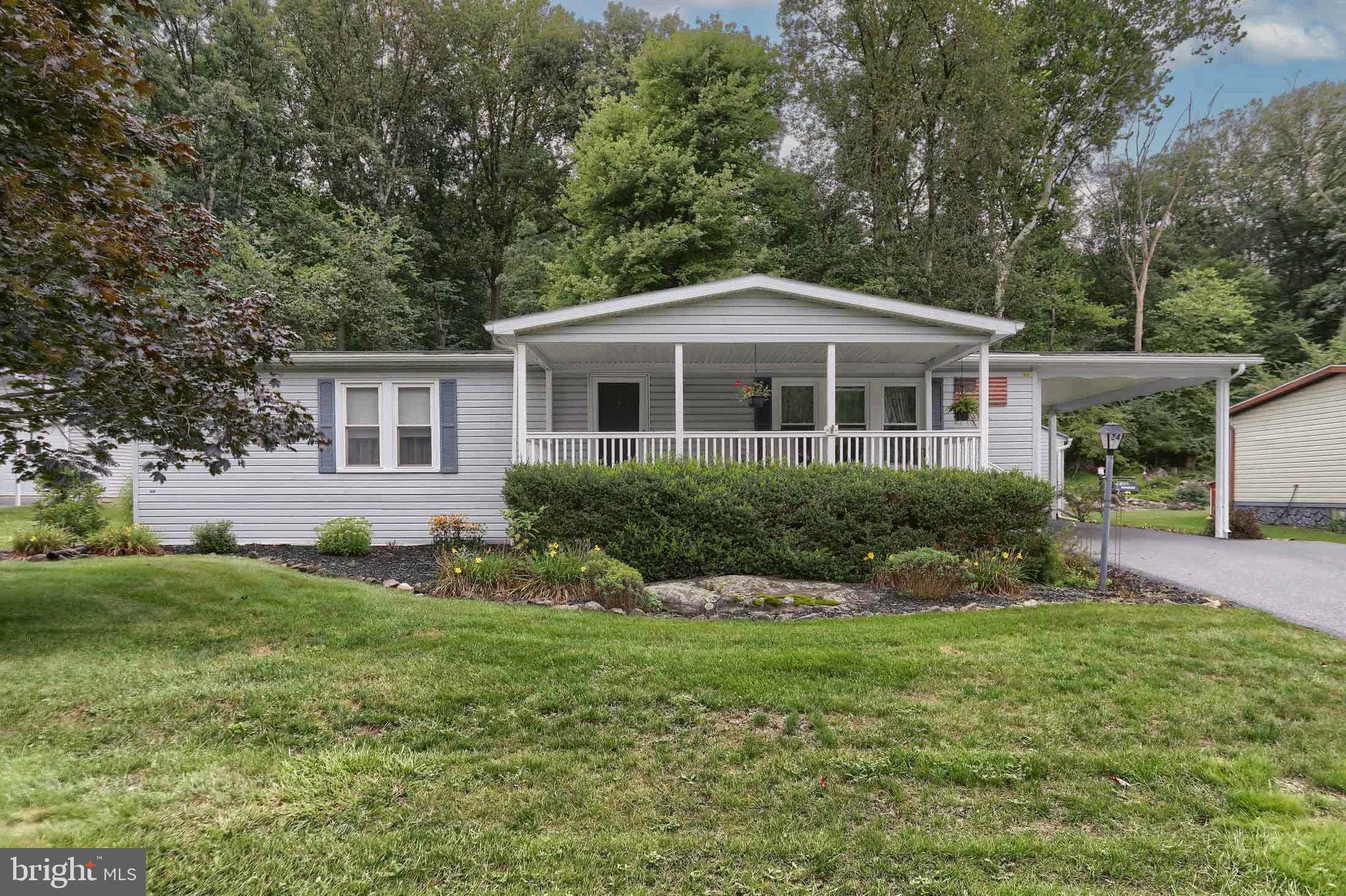 Get ready to fall in LOVE with 24 Maple Avenue!
Located in the desirable 55+ community of Gretna Springs, this home offers 1,400+ sq. ft. of comfortable one-floor living.
The open floor plan seamlessly connects the living room, kitchen, and dining area—flowing into a sun-filled four-season room with a propane stove and large windows overlooking the beautifully landscaped, wooded backyard that borders the Governor Dick Conservation Area.
Inside, you’ll find a spacious primary bedroom with a private half bath, a second generously sized bedroom, and a full bathroom with a walk-in shower. All appliances—including the washer and dryer—convey with the home.
Step outside to enjoy a deck with gazebo, a covered front porch, a carport, and a heated shed with generator, providing year-round convenience and peace of mind.
Gretna Springs is perfectly situated along Route 72 between Lebanon and Lancaster, with easy access to the PA Turnpike and Route 322.
✅ Lot rent includes: water, sewer, trash, and use of the community center.