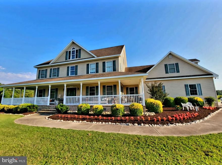 Welcome to this inviting farmhouse, originally designed as a family oasis and waiting for you to call it HOME!  A massive wrap around front porch offers lots of opportunity for old-fashioned front porch sitting, swinging, or entertaining guests while sipping on lemonade or tea to enhance the experience. 
Upon entering the home through the double front door, you're immediately immersed in the openness of the 2- story foyer with winding staircase, while your line of sight draws your attention to the open family room at the back of the home.  A custom designed stone surround completes the warmth of the gas fireplace on the back wall.   The kitchen around the corner offers privacy and plenty of space for cullinary creation while remaining open to the family room by way of the breakfast nook, which adjoins the two spaces.  Storage and workspace abound in this kitchen, which includes a walk-in/work-in pantry combined with first level laundry room.  Formal living and dining rooms flank the foyer on each side, provideing a plethora of options for living area design.  A first floor office room was specifically designed and built around an original bank vault/safe, definitely a conversation piece but also a functional, historical, oversized place to safely keep your prized possessions.  To top off the excellent design of the first floor, a primary ensuite bedroom, including huge walk in closets, a soaking tub and walk in shower, custom ceramic tile,  and double vanity provides all the conveniences of a luxury suite!  Ascending the gorgeous staircase, you first encounter the loft area, open to the grand entry foyer below;  DId I mention the chandelier has a feature that lowers it down to the floor level for easy cleaning?  Upstairs, four large bedrooms with loads of closets and storage space, a separate recreation room, and plenty of natural light flooding through many windows in each room, including multiple dormer window spaces.  The immense but homey bonus room over the garage, with it's own laundry room )W/D hookups), can be accessed from a back stairway, leading from the utility hallway off the garage, and can also be accessed from the bedroom hallway upstairs.  More dormer windows provide access for natural light flooding into the room.  The third floor provides a massive, partially finished space, with dormer areas including decorative windows for light inside and gorgeous exterior facade.  This space is ready for completion with a little vision for the possibilities it offers.  it could also serve as a convenient walk-up storage area, with a wide stairway for ease of access.  An oversized 3 car garage for multiple cars and recreational vehicles is attached to the home;  a screened porch and rear deck provide the ideal space for outside entertaining, which completes this farmhouse experience.  PRICE REDUCED BY $50,000 - GREAT OPPORTUNITY TO GET A TRULY REMARKABLE HOME AT AN UNBELIEVABLY LOW PRICE!  CALL NOW TO SET UP A PRIVATE SHOWING!