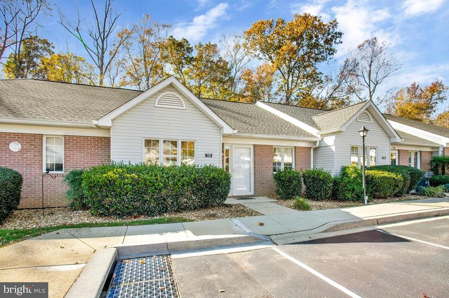 Enjoy 2,000+ square feet of living space in this well maintained home. Space to spread out in the open concept family room, dining room & kitchen areas. Beautiful laminate wood floors abound on the main level with vaulted ceilings. Separate large space in basement for **ADDITIONAL BEDROOM** space or large family room, with walk-out French doors to your patio & private treed backyard for entertaining. **FRESHLY PAINTED, with newer roof, newer gutters, **NEW STAINLESS KITCHEN APPLIANCES**  granite counter tops, and **NEW HVAC SYSTEM**. 2 assigned parking spaces with visitor parking just steps away; lawn maintenance and snow removal is taken care of for you by the HOA. The community has sidewalks, community screened-in pavilion, picnic area, and a playground to enjoy. Plenty of shopping and restaurants nearby; hospital and downtown Prince Frederick is just 1 mile away. Hurry, this one will not last long. ** Buyer to verify schools, room count, room sizes, and total square footage.**