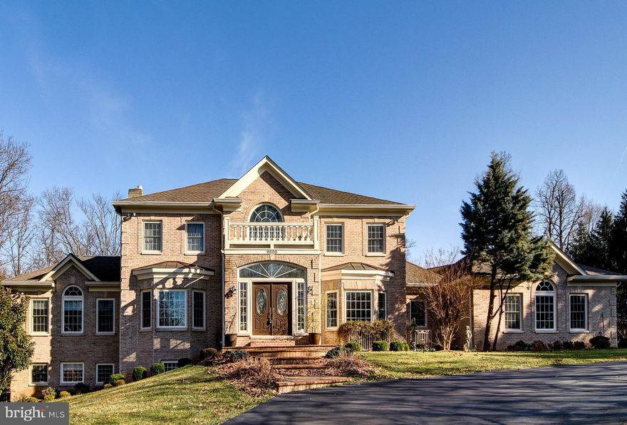 Stunning Home on  1.75 ac. 2-Story Marble Foyer w/Curved Stairs. Gleaming Hardwood Flrs. 1st Flr MBR Suite w/FP. Light & Bright 2-Story Family Room. Gourmet Kitchen has Thermador 6-Burner Range, Granite, Stainless Appls & Range Hood. 4 Add'l Oversize BRs w/BAs Upper Lvl.  Huge Fully Fin, Walk-out Lower Lvl-Rec Rm w/Wet Bar, Game Rm, Exercise Room, and more! 5-car Garages. Expansive Deck Spans Rear