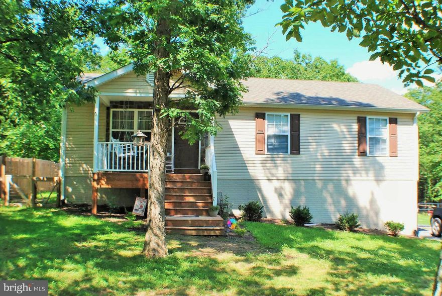 Well Maintained RANCHER ON a half acre wooded lot.Enjoy your rear private deck leading to a large fenced back yard with a huge 2 story storage building.Finish the walk-out basement and nearly double this home's living space.Stained natural wood trim & Laminate floors throughout main level, Well-appointed Open Kitchen, Living room has vaulted ceilings,New Carpet in the bedrooms. Home Warranty Avail