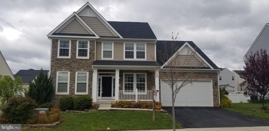 This beautiful colonial lacks nothing.  The owner had just about every upgrade available added to this house.  Some of the upgrades include, stone front, morning room, granite countertops, stainless steel appliances, hardwood floors, ceramic tile floors, double sinks in both the master and hall baths, tray ceiling in master bedroom, 8' wide basement stairway and stamped concrete patio.  She also added vinyl and invisible fencing along with a storage shed in the backyard.  The basement has a very large finished rec room and an unfinished storage area.  Basement also has a full bath rough in.  The sellers were in the process of finishing it before they decided to move.  Most all of the materials have already been purchased and will convey.   All appliances will convey.  The sellers are in the process of moving most everything out.  So there will be a few misc things laying around.