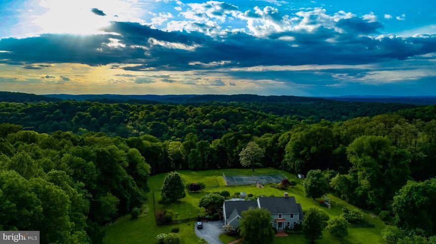 A picture truly is worth a thousand words!! This   11 acre paradise is ready for a new owner to appreciate  with every season.  Pool, pool house, wonderful gardens and tennis court are ready for your enjoyment. This home has been attentively maintained and upgraded throughout ownership with newer kitchen  and baths and lots of hardwood. The spacious home offers 5 bedrooms and plenty of  living and entertaining space. The location is convenient for shopping, schools and commuting.