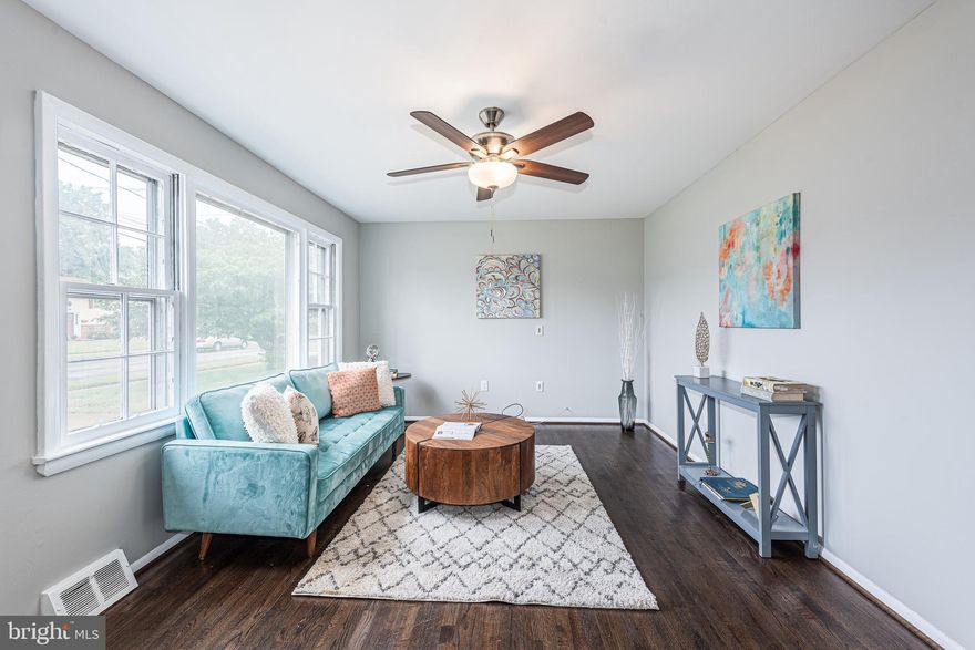 BEAUTIFULLY DESIGNED RENOVATED RANCHER ON A LARGE LOT AND LOCATED IN A CONVENIENT LOCATION!  Features include wood flooring throughout, an inviting living room, a gourmet kitchen with granite counters, ss appliances, and a dining area, 3 main level bedrooms with a hall bath, a finished basement with a family room with a wood stove, half bath, and laundry/storage room, a main level enclosed porch which overlooks the large fenced yard with a storage shed, and driveway parking.  Newly renovated including new AC unit and water heater.  Located minutes from major commuter roadways and BWI!