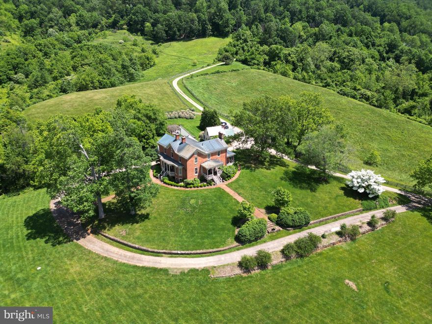 Historic Inn for sale in Sperryville, Virginia

Unique Opportunity
Experience the serenity and breathtaking scenic views of rolling foothills and grazing pastures with this exceptional opportunity in Sperryville, Virginia. This residence, with a rich history dating back to the 1820s, has been meticulously preserved for generations. For the past 12 years, the owners have shared this extraordinary home as a popular inn. Now, it is available for sale as either a full-time residence or a continuing inn/bed and breakfast business.

Property Overview
Perched atop a hill, this historic inn offers panoramic views of the Blue Ridge Mountains that fill the skyline as far as the eye can see. The simple rectangular structure was built from bricks fired on the banks of the Thornton River and trees harvested from nearby Turkey Mountain. The beautifully landscaped front yard provides a welcoming approach to this historic gem.

Main House Features
Architectural Charm: The main house boasts original hardwood flooring, high ceilings, and two fireplaces, maintaining its historic charm.
Living Spaces: The main level houses a large living room and two bedrooms, each with ensuite baths.
Upper Level: Upstairs, you’ll find three more bedrooms, each featuring ensuite baths and breathtaking mountain views. The rooms are beautifully decorated with furniture and artwork collected by several generations.
Natural Light: Ample windows and high ceilings create a light and open atmosphere throughout the home.
Dining and Kitchen: Below the main level, a spacious formal dining room can accommodate more than 14 guests. The large kitchen has been updated with modern amenities, including a stainless steel refrigerator, granite countertops, and abundant cabinet space.
Innkeeper’s Quarters: Adjacent to the kitchen and dining area, the innkeeper’s quarters consist of a large bedroom, a bathroom, and office space.
Modern Amenities: High-speed internet and a Tesla charger (subject to verification).

Additional Cottage
This listing includes a charming cottage just steps away from the main building, perfect for extended family and friends. A blend of comfort and character, the cottage features a spacious sitting area, a small kitchenette, a full bath, and a bedroom.

Location and Lifestyle
Dining: Close to sought-after culinary experiences, including Three Blacksmiths and the Inn at Little Washington.
Proximity to Attractions: Conveniently located approximately three miles from the Thornton Gap entrance to Shenandoah National Park and ten miles to Old Rag Mountain. 
Local Charm: Enjoy the quaint village of Sperryville, known for its serene landscapes and proximity to local wineries and breweries, art galleries, and antique shops.
Outdoor Activities: Ideal for nature lovers, with numerous hiking trails, fishing spots, and outdoor adventures in the surrounding areas.

Whether you’re seeking a full-time residence with historical charm or looking to continue operating a successful inn, this historic property is ready to accommodate your vision. Don't miss out on this rare opportunity to own a piece of history in Rappahannock County. Envision yourself living in this magnificent home and creating a gathering place for family and friends.

Embrace the Charm
Discover the unique blend of historic charm and modern amenities that this beautiful property offers. Schedule your showing today and embrace the opportunity to make this extraordinary inn your new home or business venture.