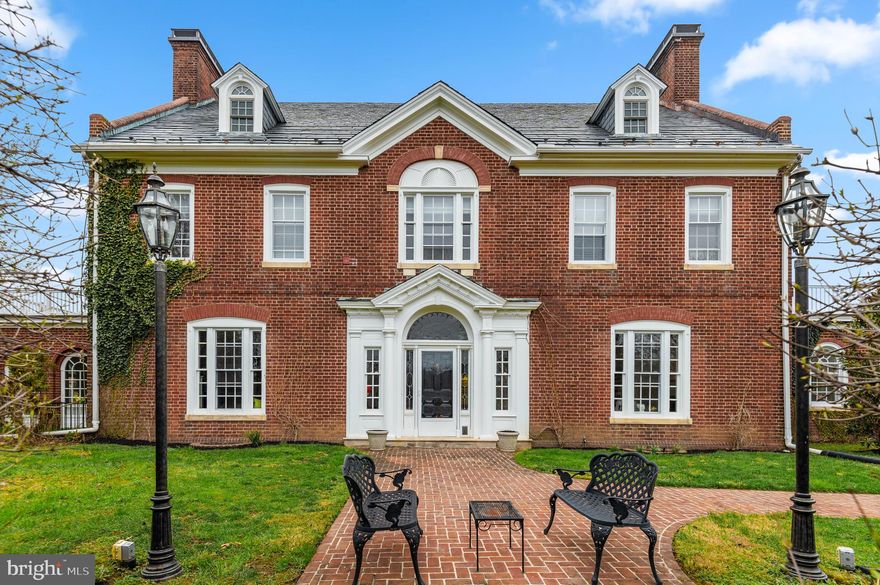 Step inside a timeless masterpiece.

Be just the fourth owner of this historic mansion, designed by noted architects Wilson Levering Smith and Lawrence Fowler. It was commissioned and built following the marriage of the heirs of two prominent Baltimore families.

Completed circa 1914, the home has been meticulously restored and enhanced by its current owners. The heavy lifting has all been done. The next owners get to move in and live their Georgian Revival fantasy!

Major recent upgrades to the property include the complete renovation of the heated swimming pool, including all new equipment: heater, lights, electric, gas line, coping, tile, and pool deck.

Enter into the expansive center hall and let your eyes wander up the wide, spiraling staircase. To your left is a formal living room like no other. Designed by Pascale de Fouchier of PDF Interiors, the space is a livable showpiece. It is accented by elaborate crown molding and features a working wood-burning fireplace. It leads into the massive, gorgeous sunroom with its surrounding arched windows.

There will be room for all of your guests and their guests in your dining room. With its soaring ceiling and moldings, yours will be the dinner parties that friends can't wait to attend. The butler's pantry with restored original cabinetry is a dramatic gem that transitions into your light-filled, dream kitchen.

The kitchen and butler's pantry have been fully renovated, with high-end appliances featuring a chef-grade Blue Star stove, top line Miele dishwasher, GE Profile built-in refrigerator, Uline beverage center, and Hoshizacki professional grade ice maker cabinet.

The owners have installed Reico Design Line custom cabinetry, added a built-in banquet, a hidden broom closet, Carrara marble countertops, and reverse osmosis water filtration.

Upstairs will be your oasis. The gracious primary suite features a dressing room and a balcony. The three additional second-floor bedrooms are light-filled and large, with two more full baths. The top or third level features an additional four bedrooms, two full baths, and a bonus room.

Other major projects completed by the current owners include restoration of the windows, four bathroom remodels, remediation of lead paint and asbestos, substantial plumbing and electrical work, restoration of the living room fireplace and chimney repairs, addition of Coretec Plus 7" Midway oak flooring, moving the washer and dryer upstairs and more. A full list of renovations and upgrades is available in the disclosures.

Tucked away inside Woodholme Reserve but not part of the HOA, this historic grand dame is an elegant and sophisticated capsule of the Progressive Era.