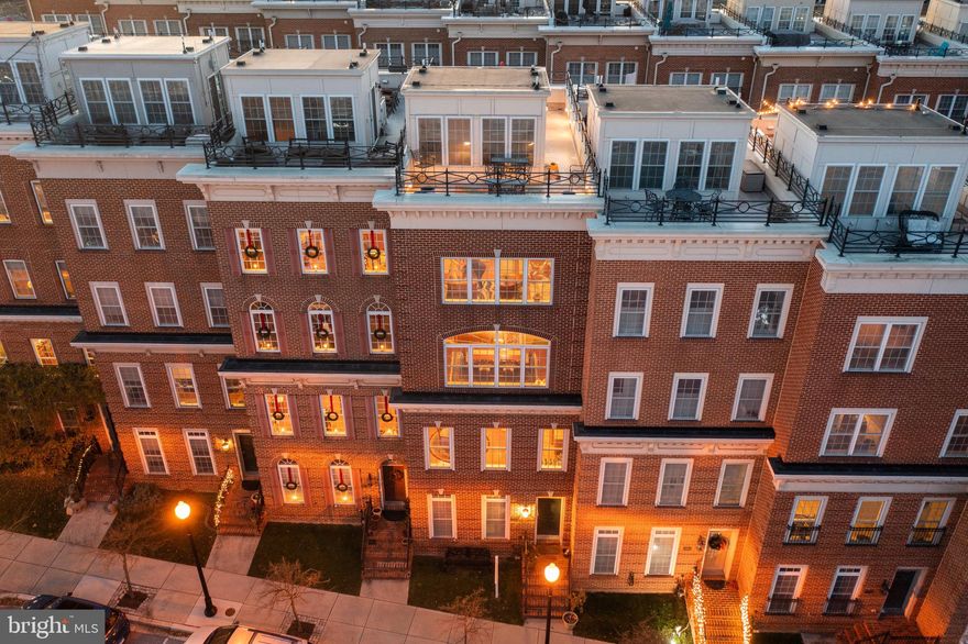 Welcome to 1314 Belt St. This five story townhome has an *elevator* for convenience to each level. The elevator mechanics and motherboard have all recently been updated to the latest cutting edge technology. This home has recently been updated with solid oak flooring to run throughout the entire home. Walk into the front door to find a workout room or office to the left, the entrance to the elevator off of the foyer, and an entrance to the two car garage. Travel up the grand oak stair case to the second level where you will find a large living room with a gas fireplace and stunning 10 foot ceilings. Large wide windows cover the entire home so that every room is draped with natural sunlight. The kitchen is to the right of the second level with an open concept floor plan and breakfast nook off of the gourmet kitchen. There is a half bathroom on the second level for convenience. Travel up to the third level or take the elevator where you will find two spare bedrooms, both with their own full bathrooms, a separate laundry room, and a grand dining room that sits in front of an enormous bay window. On the fourth level you will find the owners suite to the left with a large walk-in closet, a large en-suite bathroom with a double sink vanity, stand up shower with bench, and a separate soaking tub, and private potty room. To the exterior of the owners suite there is a bonus room with a wet bar and a large window with an unobstructed view of the entire inner harbor. The specific location of the homes on Belt Street allows for an unobstructed Harborview from this entire row which is specific to this row only. Off of the bonus room travel the stairs, or take the elevator, to the fifth level to find the roof deck sunroom. There are two sides to the roof deck. One is larger than the other and could fit a big patio dining table for a large party of guests and the other side is just slightly smaller with one of the most breath taking views of the city skyline and Baltimore Harbor. This home has warm charming hues, elegant character, has been meticulously maintained. * Fresh Trim & Paint Package Just Added*