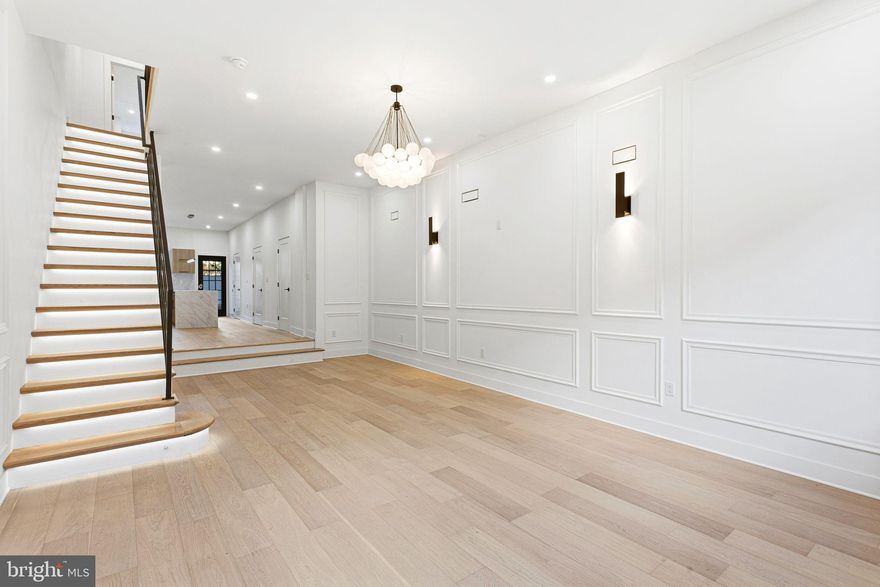 If you’re searching for a home that blends luxury with modern sophistication, your search ends here. Welcome to 1419 Wharton Street—the ultimate urban retreat.

This impeccably renovated three-story residence features 4 spacious bedrooms, 2.5 baths, and a bonus room off the primary suite, complete with a wet bar and access to a stunning roof deck showcasing panoramic city skyline views.

Step through the front door into an impressive grand living room with soaring 20-foot ceilings, beautifully accented with wainscoting. Just beyond, you’ll find an elegant eat-in gourmet kitchen outfitted with European cabinetry, quartz countertops, and an oversized island perfect for entertaining. The kitchen is equipped with premium slate stainless-steel appliances, a walk-in pantry, laundry room, and a conveniently located half bath.

The professionally hardscaped backyard, finished with Greystone pavers, creates the perfect outdoor gathering space.

Retreat to the luxurious primary suite featuring a spa-inspired ensuite bathroom with a soaking tub and dual showerheads. All bathrooms boast imported Italian tile, and the entire home is enhanced by custom lighting, designer HVAC vents, staircase lighting, a fully finished basement, and countless high-end upgrades. No expense was spared by this meticulous builder.

Located just one block from Broad Street and within walking distance to Center City, Rittenhouse Square, Liberty Place, and all the world-class amenities downtown Philadelphia has to offer, this home checks every box.

Don’t miss this exceptional opportunity—schedule your showing today!