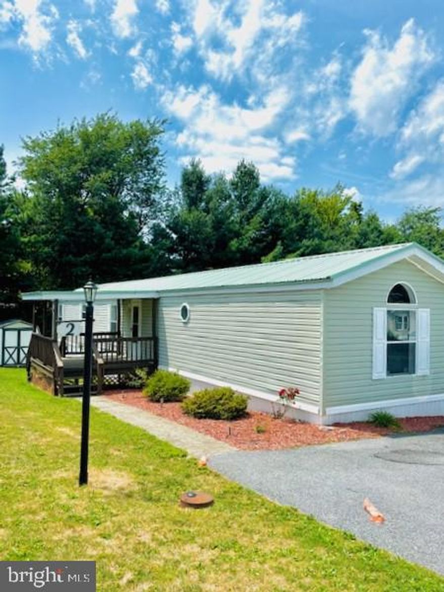 1997 Skyline Manufactured home with many newer features. Covered front porch welcomes you home.   Roof is 6 years old and A/C unit is 2 years old with a 10-yr transferrable warranty.  Main bathroom has a newer walk-in shower and skylight.  All appliances convey.