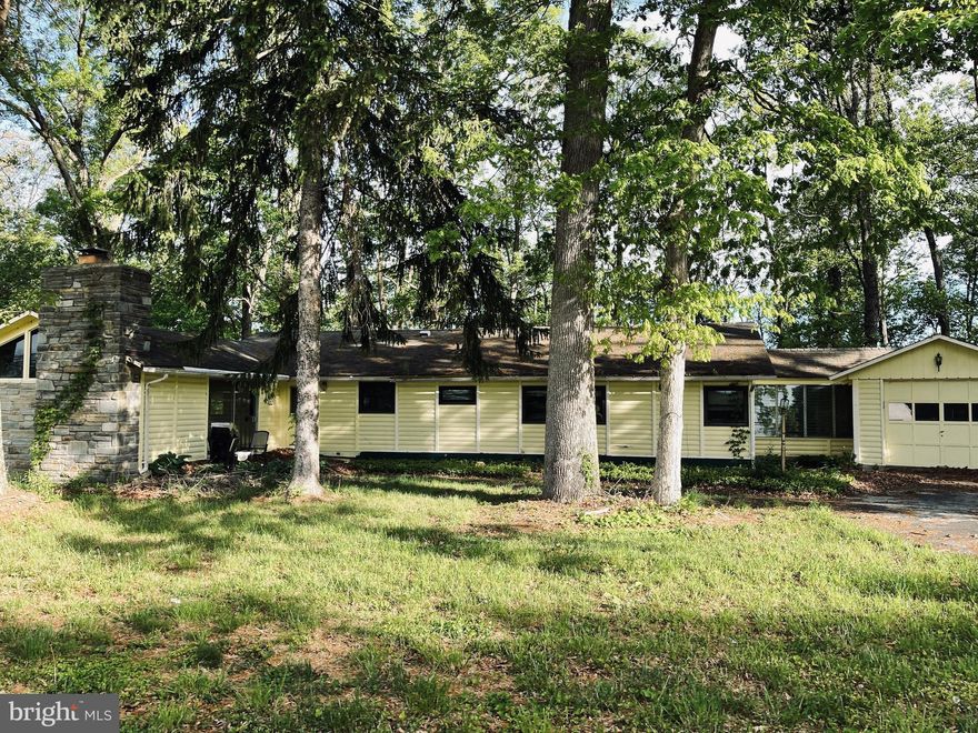 Come and see this cozy rancher home that sits on over 1.5 acres in Resisterstown, Maryland!  Home features  an open floor plan with spacious room sizes, hardwood  floors, Cathedral ceilings with exposed beams and crown molding. The main level boasts a large living room with stone fireplace,  formal dining room, nice sized eat-in kitchen, spacious bedrooms with built-in closets & ceiling fans, and light-filled sun room with great view of the rear yard, The fully finished lower level showcases a large family room,  utility room and a full bath. The garage locate at the front makes this home complete!
