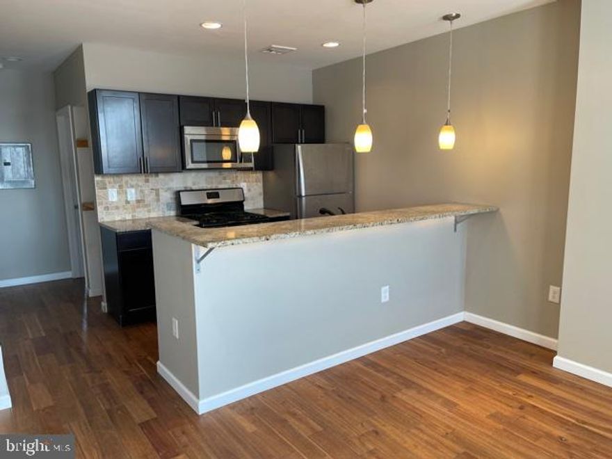 Brand new, fully remodeled unit in University City with. This apartment features real hardwood floors throughout, real stone in the bathroom, and granite countertops. Modern open kitchen with stainless steel appliances, gas range, and over-the-range microwave oven. The living and dining have more than enough space to entertain guests all year around. Bathroom has beautiful travertine tile with backsplash, modern sink, and vanity. This building has washers and dryers in basement. The unit has tons of natural light, new windows, central heat and A/C. The location is amazing, just blocks from Drexel and Penn, in the heart of University City and all the bars and restaurants you can imagine!
