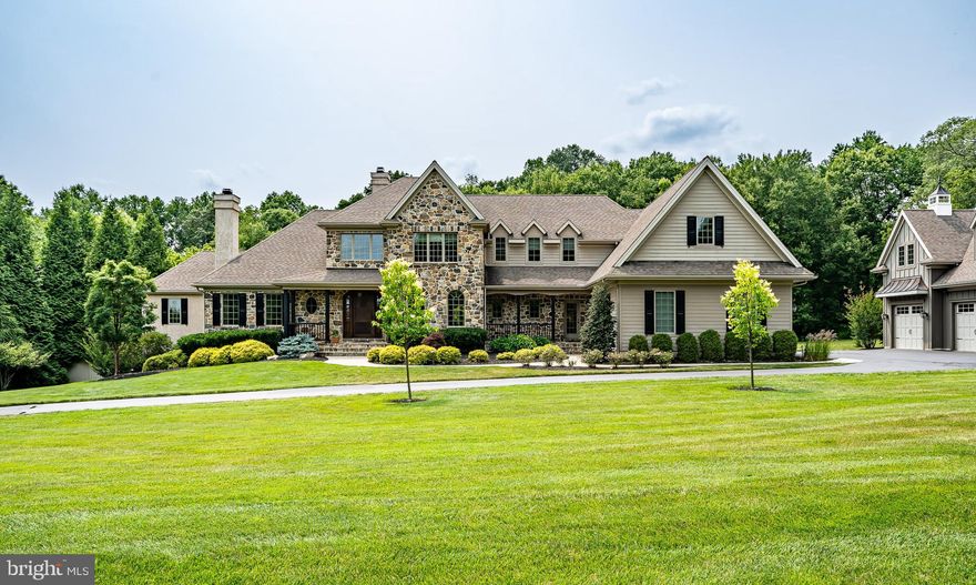 Located in the award-winning Unionville-Chadds Ford School District and set on 2.6 acres, is this fabulous four bedroom, 4.1 bath home boasting approximately 6,500 square feet of quality living space. Designed by renowned Mainline architect Scott McIntyre of McIntyre Capron, and built by highly regarded custom builder R J Dambro, the home’s design, construction, workmanship and finishes are of the highest caliber. The first-floor features quarter sawn oak flooring, custom raised panel wainscoting, numerous arched openings that separate rooms and multiple gas fireplaces. You will love the spectacular gourmet Kitchen with Wolf stove, two Sub Zero refrigerators, and three ovens, loads of storage space, granite tops, large island and generous pantry. Off the Kitchen is a Breakfast Room that opens to a very private covered porch. The dramatic Living Room features a fireplace with marvelous cabinetry, a slightly curved wall with multiple windows and an 18-foot ceiling. The gracious dining room and neighboring butler's pantry are conveniently located next to the living room and kitchen. Open to the kitchen, the Family Room has a lofted ceiling, fieldstone fireplace and a wall of windows set around a central Palladian window. The main level is rounded out by a Primary Bedroom Suite complete with a stunning bathroom, large walk-in closets, and an adjoining Home Office with a fireplace. Upstairs are three bedrooms, one with a Jack & Jill bathroom and another with an ensuite bathroom, all fans and large closets with additional built-ins There is also a spacious (16’ x 34’) Bonus Room. There is a finished Basement with a large Screening Area to enjoy the best of Netflix or the big game. There is also a full bath, an Exercise Room with an interlocking rubber floor, a professional Bar with all the amenities and a wonderful spot for the pool table or other table game. The lower level also has plentiful unfinished space for storage. The home also features energy efficient geothermal heating and cooling. In addition to the attached three car garage, there is a custom-built detached oversized two-car garage with radiant floor heating, separate powder room, upgraded electric and additional storage space above that could become an office or guest suite. This building is a great asset to the property and is a hobbyist’s dream! The property is convenient to the Route 1 corridor and an easy commute to Wilmington and is only 45 minutes to the airport. This house has it all - great schools, superior location, quality construction, superb floor plan, and a home that has been immaculately maintained!