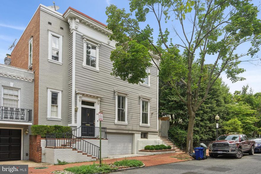 OPEN SUN DEC 10th 2:00-4:00pm! Built in the 1860s, this charming semi-detached residence is nestled in the heart of East Georgetown. Situated among a collection of handsome houses, the stunning property offers a unique opportunity to experience the timeless elegance of the neighborhood. Step inside 3115 O Street NW and be greeted by the gracious living room, a space that sets the stage for countless entertaining possibilities. Adjacent to the living room, an open chef's kitchen awaits. The kitchen seamlessly connects to a cozy family room, allowing for effortless interaction between these two spaces. Both the kitchen and family room offer direct access to a truly exceptional, deep-walled garden, creating a seamless flow between indoor and outdoor living through two sets of elegant French doors. With 4 spacious Bedrooms, 3.5 Baths, and covered garage parking, this quintessential Georgetown home is a rare opportunity!