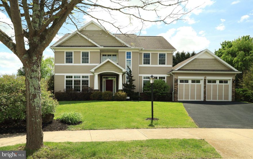 Beautifully designed and impeccably maintained modern style home with traditional touches in the highly desirable Stearns Crossing neighborhood. Great for entertaining, this lovely home offers a very open floor plan with a soaring great room ceiling and 9' ceilings throughout the first floor. The modern eat-in kitchen features a huge island, granite counter tops, stainless steel appliances including a 5 burner gas range and a kitchen pantry will roll out drawers. The open great room boasts gleaming hardwood floors and a wall of windows including a french door to the rear paver patio. The first floor includes a spacious owner's suite with a lovely owner's bath featuring a tile shower and separate soaking tub along with a double bowl vanity. you will love the large walk-in closet. Tucked away for privacy is the den/office area that offers a wall of built-ins and great natural light from the large windows. Once upstairs you will be impressed with the 3 spacious bedrooms including an en-suite. There is also a lovely open space for your own private reading room , craft room or second den. The Laundry is conveniently located on the second floor as well. Cross the hard wood walkway with wrought iron railings to the other bedrooms and full bath. The lower level of this incredible home boasts a huge family room with a built-in counter top are for entertaining or gaming and there is also a full bath and a Murphy bed for family or guests. The balance of the lower level is unfinished for amazing storage or make it your workout room or workshop. Bilco doors are available to get to the backyard. The sizable backyard is impressively landscaped and includes a huge paver patio with a lovely sense of privacy. There is also plenty of space for play areas. You can use the nearby walking path to get to the elementary school and additional outdoor fun! Schedule your showing today!