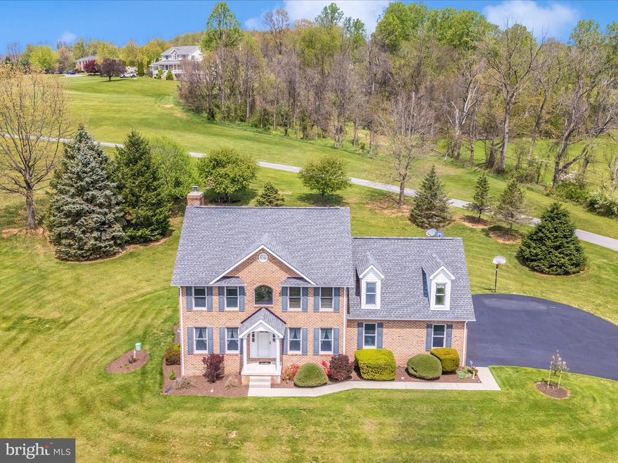 Welcome to this stunning 3-4-bedroom, 2.5-bath all-brick Colonial, nestled on 6 rolling acres in the highly sought-after Vineyard community of Myersville.

Tucked away at the end of a long, private drive shared by only a few homeowners, this property offers the perfect blend of tranquility, privacy, and natural beauty. As you make your way down the lane, take in the breathtaking landscape featuring open fields, gently rolling terrain, and a picturesque (fully stocked) pond complete with a dock—ideal for relaxing with your morning coffee or casting a line on a peaceful evening. There is also a large 18' X 22' shed to hold all your landscaping machinery, tools, and more!

The home's manicured lot and classic curb appeal immediately reflect pride of ownership. A beautifully landscaped walkway leads to the front entrance, where you’ll be greeted by a spectacular front yard and sweeping views—plus mountain vistas from the side of the property that make this location truly special.

Inside, a two-story foyer with gleaming hardwood floors welcomes you in. To the right is a formal dining room, and to the left, a spacious sitting room—both featuring hardwood flooring and ideal for entertaining or everyday living. At the rear of the home, the cozy family room features a brick fireplace and opens to the backyard patio. The adjacent kitchen offers granite countertops, brand new stainless steel appliances, and a bay window in the eat-in dining area—perfect for enjoying views of your serene backyard.

The rear staircase leads to the upper level, where you'll find a generously sized bonus room that can serve as a second family room, guest quarters, home office, 4th bedroom, or whatever suits your needs. Three additional bedrooms are located down the hall, along with a full bath and open hallway that overlooks the foyer below. The spacious primary suite offers a double-door entry, elegant trey ceiling, and a luxurious en-suite bath complete with soaking tub and separate shower.

The full, unfinished basement offers endless possibilities for customization—whether you’re looking to create a home gym, media room, or additional living space.

This home is impeccably maintained and truly turn-key—just move in and start enjoying the peaceful surroundings, scenic views, and all the charm this Myersville gem has to offer.