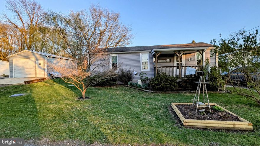 OPEN HOUSE this Sat. April 19  ** 1-3 PM ** Welcome Home ** This immaculate and fully updated rancher offers convenient first-floor living with 3 spacious bedrooms, 1 full bathroom, an office/den, and a cozy sitting room, all in excellent condition. The chef’s kitchen boasts hickory solid wood cabinets, quartz countertops, a sleek black and white backsplash, stainless steel appliances, a gas stove with hood range (propane), and plenty of prep and storage space. Additional interior features include luxury vinyl flooring, new carpet, fresh paint, a pellet stove, propane heat, a high-efficiency air filter, new washer and dryer, and new laundry cabinets for extra storage. The home is well-maintained with a roof from 2011, newer siding and gutters (2020), and newer windows. French doors bring in natural light and lead to a large, fully fenced backyard with mature landscaping—perfect for entertaining—featuring a firepit, large shed, Rubbermaid shed, and an oversized detached pole building with a wood stove, ideal for a workshop or hobby space. There's parking for up to 5 vehicles, a welcoming front porch, and a backyard entertainment area. Conveniently located near Ft. Ritchie Center and the lake, this home also offers public water and sewer, making it a truly move-in-ready gem.