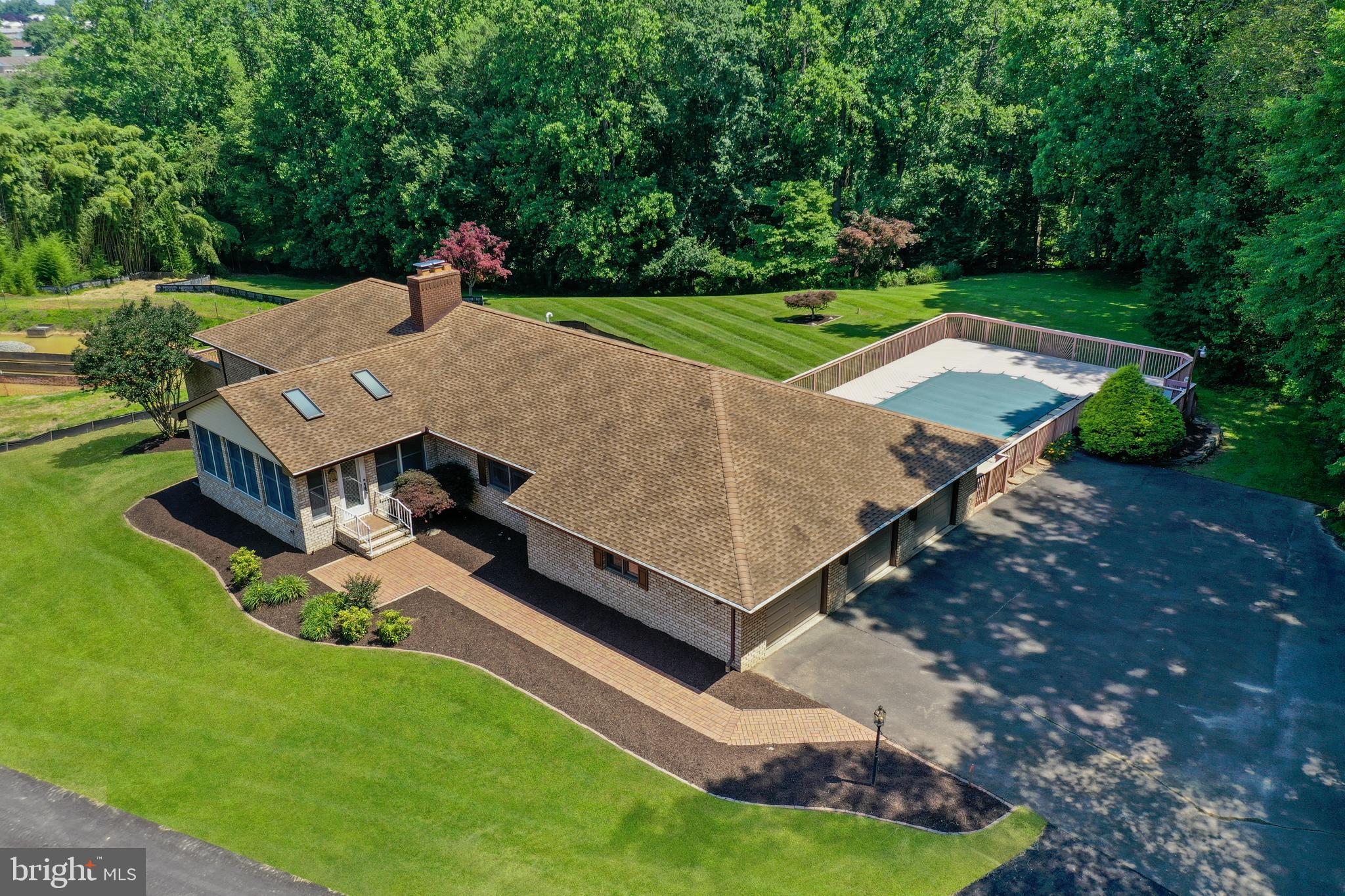 To be offered for Public Auction on Wednesday, July 16, 2025 at 12 Noon. The list price is the suggested opening bid and not the anticipated sale price. $ 15,000.00 Contract Deposit required. 5% Buyer's Premium. Settlement by August 29, 2025. Enter into the family room with vaulted ceiling and 4 skylights, surrounded by windows for natural light. Living Room with raised brick fireplace with marble mantle and sliding glass doors to the rear wrap-a-round deck. The kitchen was renovated in 2024 with granite counters, 42" cabinets, tile backsplash, stainless steel appliances, breakfast bar, laundry closet, and access to the rear deck. The lower level is completely finished with family room/kitchenette, 2 bedrooms, office, and full bathroom with soaking, jetted tub and separate enclosed shower. Walk out from the lower level family room to a covered brick patio. The expansive rear wrap-a-round trex deck opens to the pool deck area with an in-deck gunite swimming pool. The property backs to a stream and is adjacent to over 100 acres of land which is permanently conserved under a joint Maryland Environmental and Historic Trust Easement. This property is not subject to the HOA dues, covenants and restrictions, and water and sewer facilities charges as set forth for the new subdivision of Roberts Crossing. See MLS documents for the detailed brochure, auction terms, and Seller disclosures. All Buyers must register on the day of the auction.