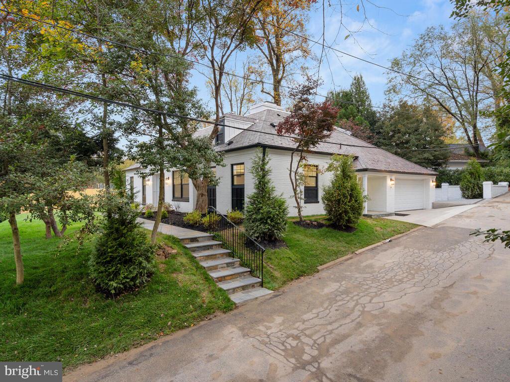 "OFFER DEADLINE MONDAY 01/04/2021 BY 4PM" Beautifully renovated home, natural light-filled with updates and high-end finishes throughout with space for relaxing and entertaining. This expansive 4 bedrooms, 4.5-bathrooms home boasts elegance! It has a separate large living room (with natural gas fireplace), family room, and dining room. It has oversized Energy Efficient Andersen Windows, JELD-WEN interior doors, fiberglass front door, Andersen sliding glass patio door, recessed LED lighting, quartz wrap around kitchen island, and stunning wide engineered hardwood floors throughout. The chef's kitchen is outfitted with fingerprint resistant-black stainless-steel top-of-the-line energy efficient appliances! Main Level Master suite includes walk-in closet, LED mirror, free stand bath tub, marble/porcelain tiles, double modern vanity, and shower panel with body spray. Upstairs you will find two spacious suites, each flooded with natural light, and equipped with large walk-in closets, an additional bedroom, a full bathroom, and a large walk-in Laundry. New Carrier Infinity 19 Seer 5 Ton HVAC System. Maintenance free exterior PVC fascia, brick walls, natural stone slate roof, and 6" gutter with cover. Concrete stamped back patio, concrete stamped parking pad, two car garage, and flagstone front stoop and walkway. Private/ Quiet alley with lots of parking spaces. Enjoy the desired lifestyle and Location of this great home with close proximity to DC, and to the excellent shopping and dining of Friendship Heights and Bethesda! Move-in ready! Very quiet inside, come see before its gone!