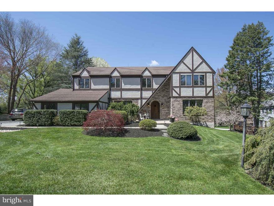 Welcome Home! 813 Northwinds Drive in the coveted neighborhood Radnor Chase has it all. Optimal Location  Superb Condition Functional Floor Plan! This 5 Bedroom Tudor Style Center Hall Colonial has been renovated throughout with great thought and attention to detail.  Enter through the Two Story Foyer and you will feel right at home. The Formal Living Room is bright and spacious. The chair rail, crown molding, and French doors opening to the Great Room are just the beginning. The dining room is simply elegant. The Gourmet Eat In Kitchen is a 10 out of 10 Cherry Cabinets, Center Island, Stainless Appliances, Under Mount Lighting, Tile Backsplash, Gas Range with Custom Hood.  The kitchen opens to the Great Room, giving you the open layout for everyday living or an evening with friends by the wood burning brick fireplace.  The Master Bedroom Suite is your own private oasis. The Balcony looks out into the lush back yard. The renovated ensuite bath is spa-like with Heated Tub ,Dual Vanity, Tiled shower with Custom Glass Door, a Walk In Closet and a Sitting Room/Office that will surely impress! There are three other generous sized bedrooms and full bath on the second floor. The finished renovated walk out basement is enormous. The space includes a 5th bedroom with en suite full renovated bath, great for out of town guests or an in law suite. The main finished space can be used for a media room, game room, gym space or sectioned for all three! Don't forget the Three Car Garage, Loft off the third Bedroom, Walk Up Attic, Wet Bar Option in the Great Room, Minutes from Septa R-5 Train-Downtown Bryn Mawr-Downtown Wayne.