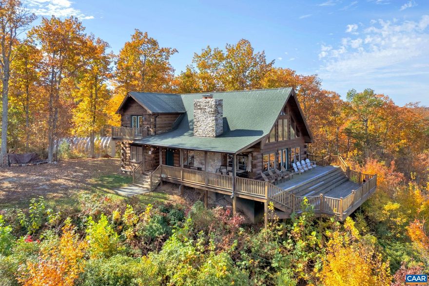 MOUNTAIN RETREAT located on a ridge facing west to a breathtaking view of the Blue Ridge Mountains and a mile of James River frontage below as a part of this incredible 261 acre mostly wooded property. Cross Kidd Creek as you drive onto the property and continue for 8/10ths of a mile on the private road to the top of the mountain and the lodge. On arriving at "The Cabin", as referred to by the family and locals, you will be greeted by a heavenly view of the James River, Norwood Road valley and the Blue Ridge Mountains that spans for as far as the eye can see left and right. The lodge is solidly constructed of the finest materials including log exterior, exposed interior beams, wood floors, granite and tile. The massive stone wood burning fireplace is the centerpiece and adds warmth to the entire main living area. The porch and tiered wood deck provide space for outside entertaining, enjoying the daytime views and stargazing the clear night skies. The whole property is the owner's private outdoor paradise for hiking, hunting (deer, bear, turkey, waterfowl), fishing and canoeing the James. This is a rare opportunity to own a one-of-a-kind mountain retreat in central Virginia.