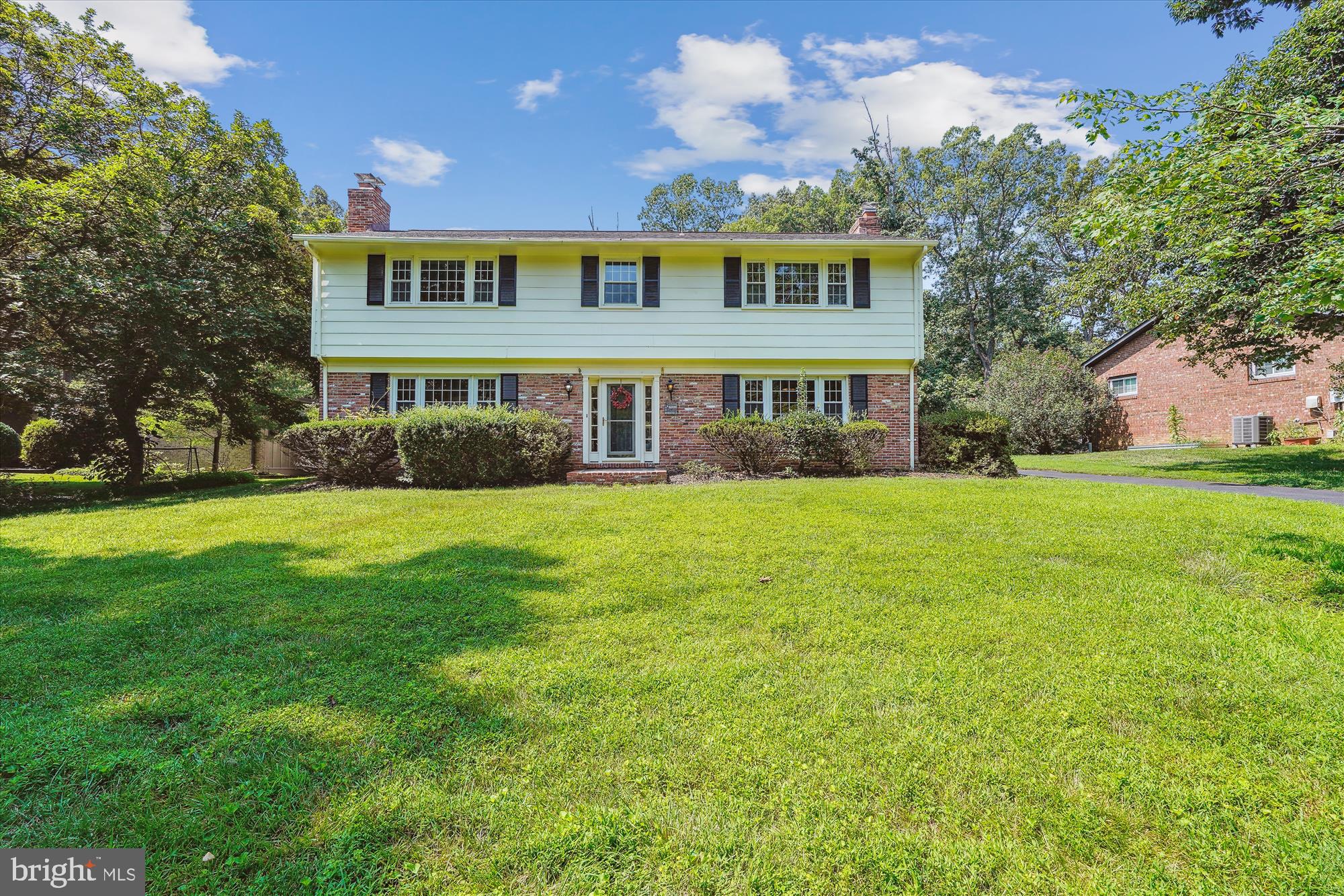 A beautiful colonial home backing to woods that is tucked away on a gem of a street with double cul-de-sacs with a price adjustment. A center hall colonial opens to a generous tiled foyer. The living room flows to the left with a wood burning fireplace, sweet mantel, and new carpet. An arched entry to the dining room takes you to the back of the home that overlooks the treed backyard. A nicely updated kitchen with cherry cabinets with a large window over the sink, quartz counter tops, and a bar overhang that looks into the kitchen from the eat-in area. The eat-in area has a large sliding glass door. The eat-in area opens to the large family room with a gas fireplace. Parquet flooring have been recently sanded and refinished throughout the kitchen, family room, & half bath. A laundry room has an additional door to the carport. The carport is oversized (26.5' x 20') and there are two storage closets on the back side of the carport. The upper level has a huge primary bedroom with a wood burning fireplace and a dressing area outside of the primary bathroom. Freshly refinished hardwood floors throughout the upper level except in the office/den that is plumbed to be a laundry room or coffee bar and was used as a playroom. True pride in home ownership with newer windows and doors as well as fully painted throughout. True charm level with three fireplaces. Quick access to the turquoise trail with fast access to Hunters Woods pool, Hunters Woods ES, Hunters Wood Shopping Center, and Fox Mill Shopping Center. A commuter parking lot is a quick walk away that takes you straight to the Metro. A perfect location as you are between Rt.66 & the Dulles Toll Road. Make it your home.