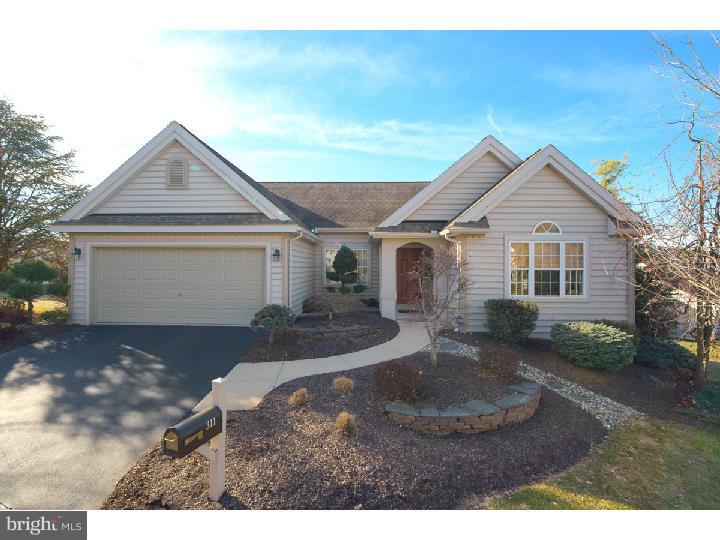 This is the most spectacular patio home located in highly desirable Spring Ridge. This one story contemporary features 4 bedrooms, 3 and a half baths, over 4,000 square feet of living space and an open floor plan. The main level consists of a tiled foyer, dining room, office with double doors and kitchen with corian countertops, cherry cabinets and granite breakfast bar. Off of the kitchen there is a carpeted sitting area with see through fireplace. The great room has a cathedral ceiling, recessed lighting and doors that lead out to a good sized deck with a nice view. There are also 3 bedrooms on the main floor, one with its own full bath. The master bedroom suite has a tray ceiling, recessed lighting and bath with a soaking tub, double vanity and stall shower. A wide staircase with artistic banister leads to the absolutely stunning finished lower level. The bar area has cherry and marble travertine floors, a kitchenette and bar that seats 5 with granite counters. There is a huge temperature controlled wine cellar, family room with coffered ceiling, gas fireplace, built-in TV and large windows allowing for plenty of light and a game room. There is mahogany wood trim throughout the lower level. The 4th bedroom is located in the lower level with beautiful travertine flooring, cherry molding and full bath with a walk-in tile shower. This property is professionally landscaped. There are so many custom touches throughout this home with quality materials used throughout.