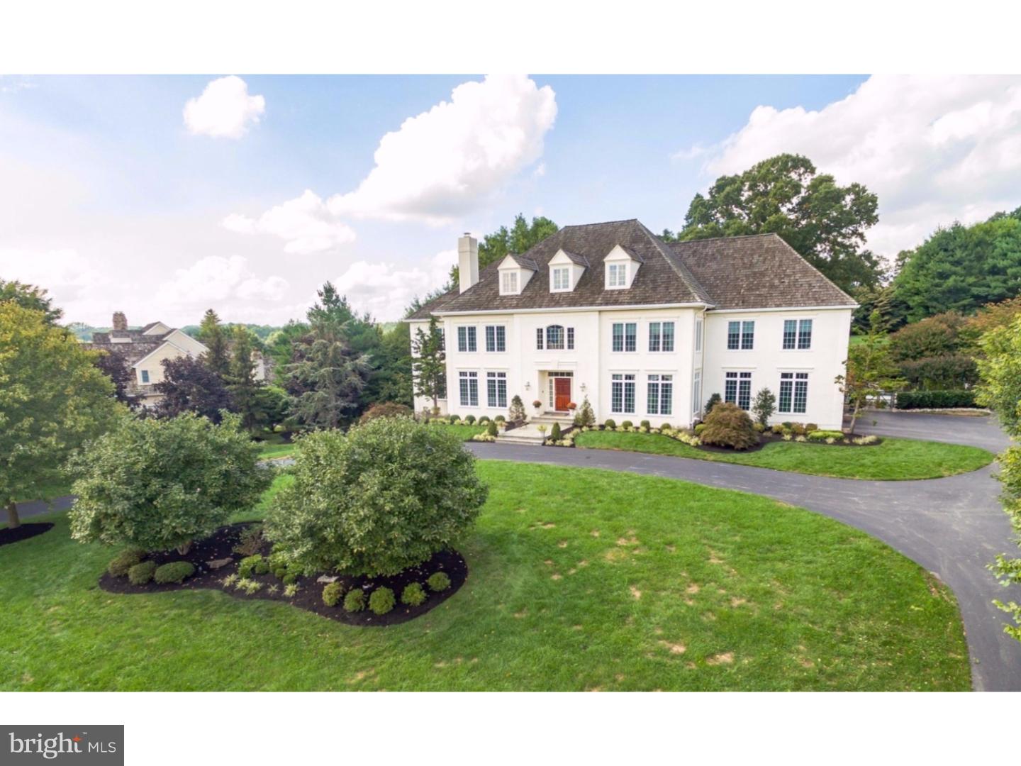 This exquisite 5 bedroom, 7 bath Manor Home in the highly desirable Harrison Estate community is beautifully designed featuring custom upgrades throughout. The two-story foyer welcomes guests & flows into an inviting open floorplan with gleaming hardwoods throughout, stunning moldings, and an abundance of natural light in every room. The formal Living and Dining rooms offer enhanced moldings, windows on two exposures, and elegant living space. The Gourmet Kitchen with its timeless design featuring top of the line professional series appliances, neutral white cabinetry, island/seating, built-in sideboard with workstation, tiled back splash, display cabinetry. Adjacent Breakfast Room with panoramic views of the private outdoor living space, including a 2000 sf flagstone patio, showcases the custom designed pool and spa. The open floor plan includes a Family Room w/cathedral ceiling centered around a stone fireplace, a wall of windows ideal for viewing summer sunsets. An elegant study, beautifully designed with executive details including 10" cherry crown molding and built-ins is privately situated on the main floor. The expansive first floor includes a grand Sun Room, two powder rooms, front and back stairwells, and a Mud Room. Luxury defining Master Suite located on the second floor, with four additional bedrooms, two ensuite and two with adjoining jack and jill baths. Finished third level is currently a spacious workout room and additional storage. Spectacular finished, day lit lower level features European designed Wine Cellar and handcrafted bar with mahogany millwork, dual sided fireplace, Media and Game Room areas, three large English Country windows, and French doors to side patio. Playroom has video monitor capabilities. Beautifully landscaped grounds include swimming pool with stone seating, separate spa, circular drive all on 1.5 acres. Four car Garage outfitted with Garage Tek organization system. Smart home technology includes an Elan whole-house entertainment system with 7 separate zones for control, , 2 HVAC's w/ 5 zones, 3 fireplaces, Security cameras (exterior), Rainbird Sprinkler System and much more. A full list of upgrades is available by request. Move in and enjoy the sophisticated amenities and convenient location this home has to offer.