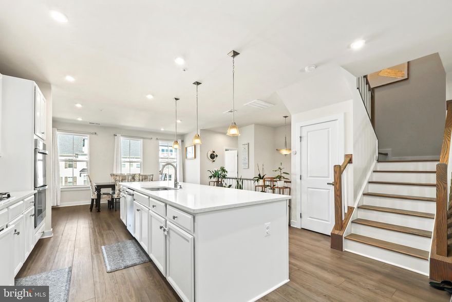 Welcome to this spacious, two-level Ryan Homes Picasso model, where style meets practicality. This upper-level condo lives like a single-family home and offers the best price per square foot in the area! The open floor plan on the first floor is bathed in natural light, smart technology creates an inviting space perfect for entertaining. The large gourmet kitchen, with its massive island and pantry cabinet, is ideal for any cooking enthusiast. The adjoining dinette and family room offer cozy spaces for relaxing or hosting, complete with a fireplace for added warmth. Step outside to the built-in covered porch, perfect for enjoying outdoor living year-round.

Upstairs, the magnificent Owner’s Suite boasts vaulted ceilings, his-and-her walk-in closets, and a Potomac River peak from the window. The ensuite bathroom is a spa-like retreat with dual vanities, a Roman shower, and a compartmentalized water closet. Also included is an upgrade separate soaking tub for added luxury. Two additional generous bedrooms, a second full bath with a double bowl vanity, and a convenient laundry room complete the upper level.  

This home also includes a one-car garage and access to fantastic community amenities such as walking trails, a golf course, and lawn maintenance covered by the association—including sprinklers to keep your grass green year-round. Experience the perfect blend of convenience, style, and comfort in this incredible home. Don't miss your chance to make it yours! 

Shores Club: The Shores Club provides a social and recreation center with a modern gym, movement studio, yoga lawn, Kids Club, and an eight-lane competition pool. You'll also find the Social Barn with family and kids' pools, sundecks, cabanas, and a convenient snack bar. Outdoor Oasis: The community offers various outdoor spaces, including an outdoor patio, community garden, working greenhouse, and event lawn, perfect for enjoying the great outdoors. Location: Just 7 minutes from I-95, you'll have easy access to major transportation routes. The property is approximately 30 miles south of D.C., a short 15-minute drive to the Quantico Main Gate, and around 18 miles from Ft. Belvoir.

Potomac Shores is an award-winning waterfront community that includes 3 swimming pools, Jack Nicholas Signature Golf Course, Elementary, Middle, and High Schools, 30-acre Ali Krieger Sports Complex, a grocery store, with soon to be built Town Center with shops, restaurants, bars, the VRE, and so much more.