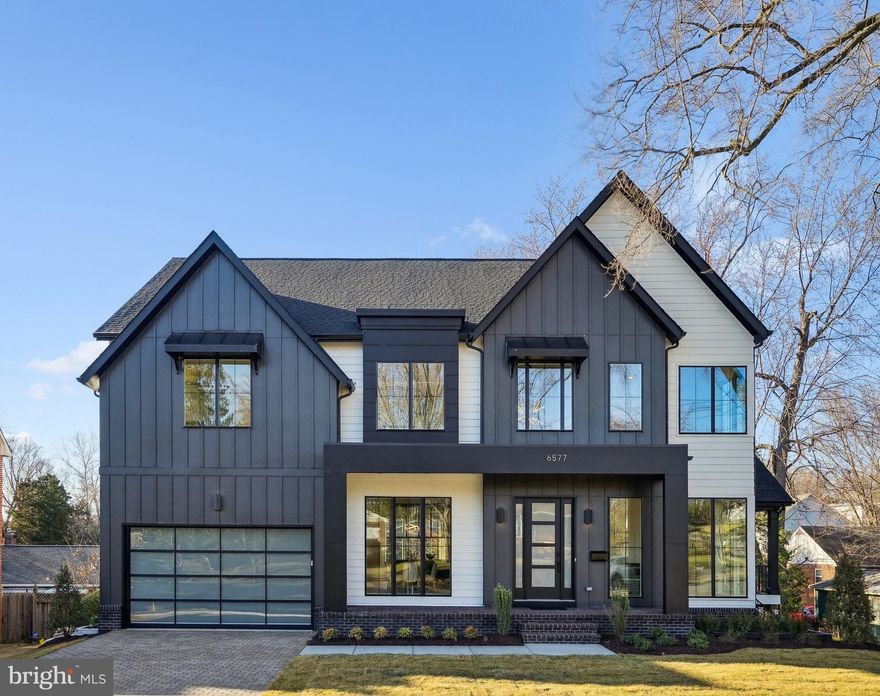 Acclaimed Beaconcrest Homes is proud to present this one-of-kind opportunity located in highly desirable N. Arlington. This custom residence offers over 6,100 gross square feet of abundant luxury and uncompromising detail while sited on a sizable and rare 10,000 plus square foot lot. The spacious main level boasts 10' ceilings, a bright and open foyer that introduces a private study, a formal dining room perfect for at home entertaining, followed by a gourmet designer kitchen that encompasses a stunning working island open to a large breakfast area, and a mud room featuring a second powder room. Luxurious elements such as beamed ceilings, a double sided fireplace shared with the covered porch help define the inviting family room and create a space of unparalleled comfort. The covered side porch, accessible from the family room, offers added livability all while connecting the house with the outdoors. The second level features 4 bedrooms, bedrooms 2 and 3 share a large buddy bath while bedroom 4 offers utmost privacy with an en-suite bath. The owners suite provides the ultimate in comfort and luxury, featuring a large and bright bedroom with a dramatic tray ceiling, a lavish spa like bath with only the finest of finishes, and an abundance of closet space that one will never want to leave. A true retreat! There is also an oversized laundry area that finishes the second level. The lower level offers an impressive 37' x 18' recreational room with LVP flooring and wet bar, coupled with outside access this space is perfect for entertaining. Additionally, a bedroom with full bath and a gym featuring a rubber mat floor are also included in the amazing lower level. Last but certainly not least, this home comes with a two car garage and finish details such as 6" white oak hardwoods throughout, custom cabinetry, high line fixtures, tech wiring, quartz counters and premium materials, this home is truly a unique opportunity not to be missed! Conveniently located to DC, Tysons Corner, Arlington shopping and entertainment, Rte. 66, and Falls Church. Fully completed.