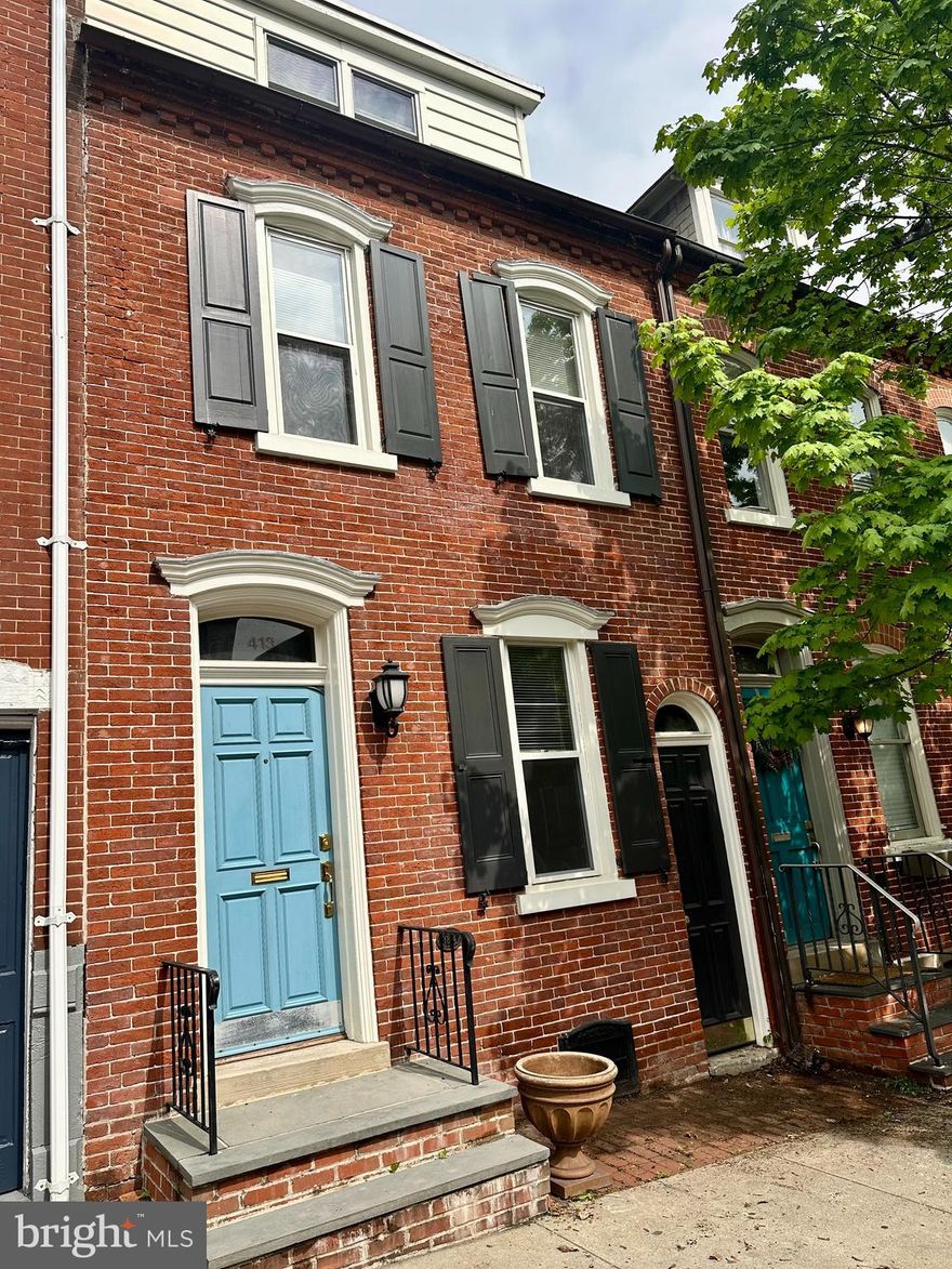 Charming brick home in the highly sought-after Old Allentown Historic District! This 3-bedroom, 1-bath residence blends classic character with modern touches. Step inside to find beautiful cherry hardwood floors that add warmth and timeless appeal throughout the home. The spacious layout offers inviting living and dining areas—perfect for both relaxing and entertaining. The kitchen features granite countertops, ample cabinet space, stainless steel appliances, and a breakfast bar. The second floor includes two well-sized bedrooms filled with natural light, while the third floor offers a private third bedroom—ideal for a guest space, home office, or quiet retreat. A unique breezeway connects the front of the home to the backyard, adding both charm and functionality. Outside, enjoy a fenced-in yard complete with a paver patio—perfect for outdoor dining, entertaining, or simply unwinding. A detached one-car garage is conveniently located at the rear of the property. Ideally located near local attractions such as Miller Symphony Hall and PPL Center, this home offers historic charm, modern convenience, and LOW taxes! A wonderful opportunity to own a piece of Allentown’s history—schedule your showing today!