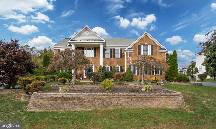 7 Pinkerton Court is a pristine North Augustine Brick Front Cul-de-sac Estate Home on a superb lot.  The lot has lush landscaping, an irrigation system, and extensive hardscape, while a New Black Aluminum Fence with Locking Gates approved for a pool surrounds the rear yard backing to nearby woods. The Home's Interior is Exquisite   Ample Windows, beautifully covered by White Faux Wood Plantation Blinds fill the home with light.  Further accented by a Two-story Foyer Entry, there's a very convenient Office or Den off the Main Foyer.  Hardwood Floors gleam throughout the Main Level, while there is a Curving Front Stairway, and Premium Crown Molding in each area or room.  The Family Room is warmed by a Gas Fireplace and has Vaulted Ceilings with a Rear Stairway ascending to Bedroom Level.  The Gourmet Kitchen is designed to Delight the Family Chef!  It's equipped to function with Stainless Steel Appliances Granite Countertops, Tile Backsplash, and a large Kitchen Island accommodating Stool Seating.  Decorator Lighting illumines, and Classic Cabinetry and Wine Rack capped by Crown Molding provide storage.  The Formal Living and Dining Rooms are flanked by elegant Decorator Columns, while the latter features Chair Railing, Tray Ceiling, and Wainscoting.  The Floor Plan is open, inviting easy flow for entertaining family and guests. The Interior of the Home is Freshly Painted throughout in Tasteful Colors, while New Lighting Fixtures illumine Hallways, Kitchen, Breakfast Nook, Dining Room, all Baths and the Basement.  New Chandeliers enchant in the Foyer and Dining Room.  There are Updated Bathroom Fixtures in four bathrooms, and Quality Ceiling Fans have been installed in Bedrooms, the Basement, and in the Screened Porch.  Having ascended to the Sumptuously Carpeted Bedroom Level, there's a Cozy Master Suite with Comfortable Bedroom and Big Closets.  In the Ceramic Tiled Master Bath, one finds a lovely two-way access Jetted Soaker Tub with Window Seating in a Triple Bay Window, and a separate Glass Shower Enclosure, again with seating.  Additional Bedrooms are amply sized, while Storage is thoughtfully arranged.  The Basement Flooring in the Spacious Recreation Room is Ceramic Tile, while French Doors with Plantation Shutters open to the Brick Patio.  A Wet Bar and a Wine Cooler offer refreshments!  There's a separate Gym Room for staying in shape, while the Media Room avails both digital entertainment and quiet socializing.  Your first year in your new home will be worry free, as all key systems are covered by a Home Warranty!Residents Love the Augustine Community.  Amenities include Fantastic Golf Club, Golf Course, Community Center, Tennis Courts and Pool, Walking and Biking Trails.  All this and the Community is convenient to Nearby Shopping, MCB Quantico, I-5 and Commute Routes North to the D.C. Beltway, and the National Capitol. AWESOME! WELCOME HOME!