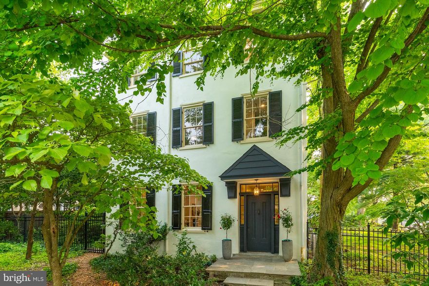 Stately Chestnut Hill home tastefully restored to preserve its historic heritage and provide every modern amenity and luxury. Built in 1850, this bright and beautiful house features 5 bedrooms,  3 full bathrooms and a powder room.  Enter through the original wood door to a large entry hall with 10’ ceilings trimmed in crown molding, grand staircase, and classic architectural details and woodwork. To your left, the parlor room has been transformed into a stylish living room and eat-in kitchen with Fisher Paykel/Miele appliances, new cabinets, range alcove, 10’ island, and 2 fireplaces. Off the kitchen is a flagstone patio surrounded by mature perennial plantings where you will spend the summer eating al fresco and bathing in the fabulous, heated pool with spa jets. French doors lead from the kitchen to the dining room with mirrored bar. At the back of the house is a spacious pantry with custom millwork and laundry/mud room leading to the garage and driveway for 5+ cars. The second floor features a dreamy and private primary suite. Enter through the large dressing room with custom closets, stone topped island, and fireplace. The spa-like primary bathroom is tiled in Carrara marble with glass shower, restored clawfoot tub, toilet room, secondary washer/dryer, and Restoration Hardware double marble washstand, lights, medicine and bath cabinets. The primary bedroom at the back of the house has a vaulted ceiling and windows on three sides overlooking the leafy grounds. Also on the second floor is a large bedroom with a luxurious en suite bathroom featuring Ann Sacks and Waterworks tile, Restoration Hardware vanity, and high-end fixtures. Third floor has 3 bedrooms and a large bathroom with Ann Sacks and Waterworks tile, Restoration Hardware vanity, and restored original clawfoot tub. New wiring, plumbing, and dual zone air conditioning system. Fully serviced and updated Buderus high efficiency boiler. The house has been newly painted inside and out and the wood floors refinished. New main roof. New pool filter, pump, and heater. Original wood windows have been restored and work in tandem with triple-paned replacement windows. The property is fully fenced with 2 side yards and a covered porch. This magnificent home is located at the top of the hill, is walkable to everything, and convenient to Center City, major highways, and the suburbs. Come have a look – the property is move in ready and will take your breath away!