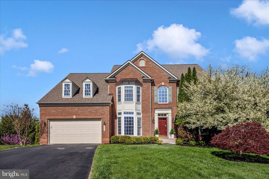 This stunning NV-built home is ideally situated on a premium cul-de-sac lot, backing to trees and offering spectacular views on one of Urbana’s most desirable streets. Lovingly maintained by the sellers, the home showcases numerous recent improvements, including fresh paint throughout, new carpet, refinished hardwood floors, a new cooktop and double ovens, a new refrigerator (2025), a new roof (2020), new HVAC systems and a commercial-grade hot water heater (2022), a new deck (2021), and a recently installed garage door.

Step inside to a dramatic two-story foyer, flanked by formal living and dining rooms, and complemented by a spacious private office—ideal for working from home. The chef’s kitchen features a large center island with breakfast bar seating and opens to a bright morning room with direct access to the expansive, low-maintenance deck—perfect for everyday living and entertaining.

Upstairs, the luxurious owner’s suite offers abundant closet space and a well-appointed en suite bath. The finished lower level is filled with natural light and designed for fun and functionality, featuring a large recreation area, game room space, rough-in for a wet bar, an additional bedroom with full bath, and ample storage.

Located within the highly sought-after Urbana community, residents enjoy access to top-rated schools and an array of amenities, including pools, fitness centers, walking trails, parks, and more—offering a lifestyle of comfort, convenience, and community.