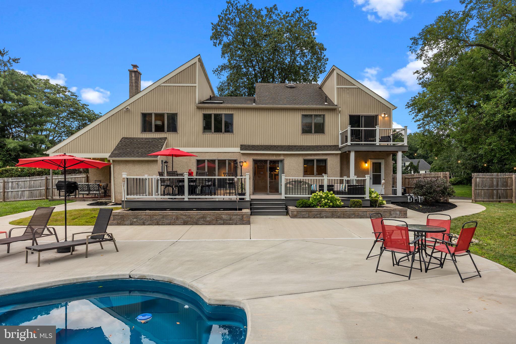 Welcome home to this incredible 4 bedroom home with amazing backyard pool, located in the highly desirable Makefield Ridge community of Yardley. Boasting over 3700 sq ft of versatile living space and set on an acre of land, this home offers the perfect blend of style and comfort with functionality. An impressive loop driveway guides you to the front entrance, where radiant sunshine welcomes you into the grand foyer adorned with soaring ceilings and a striking statement chandelier. Your foyer is flanked by a formal dining room on your left and a spacious living room that is filled with natural light from large windows and adjoins a versatile bonus room—perfect for a cozy sitting area or playroom. Continue to your beautiful eat-in kitchen designed for culinary enthusiasts, featuring a large center island for added counter space, upgraded countertops, sleek stainless steel appliances, stylish tile backsplash, ample cabinet space and sliding door access to your backyard deck for seamless indoor/outdoor entertainment! The attached laundry room features a large pantry closet for the highly sought after added food storage and convenient access to both your attached garage and backyard. Just off the kitchen, the inviting family room is ideal for relaxing with family and friends, showcasing a cozy wood-burning fireplace, a built-in wet bar and direct access to your covered outdoor patio! A convenient coat closet and powder room complete this floor. Upstairs, you'll find four spacious bedrooms, all with plush carpeting and recessed lighting and a full hallway bathroom featuring a dual sink vanity and tub/shower combo with sliding glass doors. The luxurious primary suite is a true retreat, complete with a sitting area, updated private terrace overlooking your tranquil backyard, walk-in closet, built-in marble countertop vanity area with sink, and a spa-like ensuite bathroom featuring both a soaking tub and stall shower to suit every preference! Your fully finished basement expands your living space and offers a separate room ideal for a home office, game room or even gym! An additional unfinished section offers added storage. Step outside to your private, tree-lined backyard oasis—an enchanting outdoor retreat surrounded by lush, mature landscaping that offers both beauty and seclusion. Take a refreshing dip in your fiberglass in-ground pool or unwind beneath the charming gazebo. Savor your morning coffee on the low-maintenance Trex deck and enjoy effortless outdoor dining under your spacious covered patio—perfect for entertaining or relaxing in style all year round. Additional upgrades include two-zone heating and air conditioning, NEW roof, NEW Trex Deck, NEW pool system, and a spacious 3-car garage! Ideally located close to a variety of shopping and restaurants and Yardley Boro offering the canal path for outdoor adventures yet near I 295 and the Yardley Train station for easy commuting! Pennsbury school district too! Don’t miss your opportunity to tour this beautiful home! **Seller is also including a one-year home warranty to the future buyer**