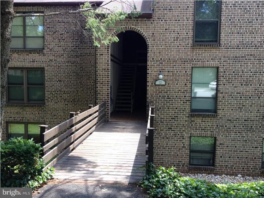 Pristine move-in condition second floor unit with balcony view of the 10th fairway and green. Freshly painted walls, hardwood floors, upgraded kitchen and baths. One floor living-great for those wanting carefree living. Condo HO covers: exterior maintenance, roof, lawncare and snow removal, as well as TV basic cable, water service, plus washer and dryer use and maintenance. Great balcony to the rear with view of tall trees. Includes recent servicing to heating and air conditioning. Enjoy the Flying Hills life style: playgrounds, basketball and tennis courts, walking paths, swimming pool and 18 hole glf course. Relax after work and enjoy fine dining and drinks at the Bistro with friends, family and neighborts. Live the food life.