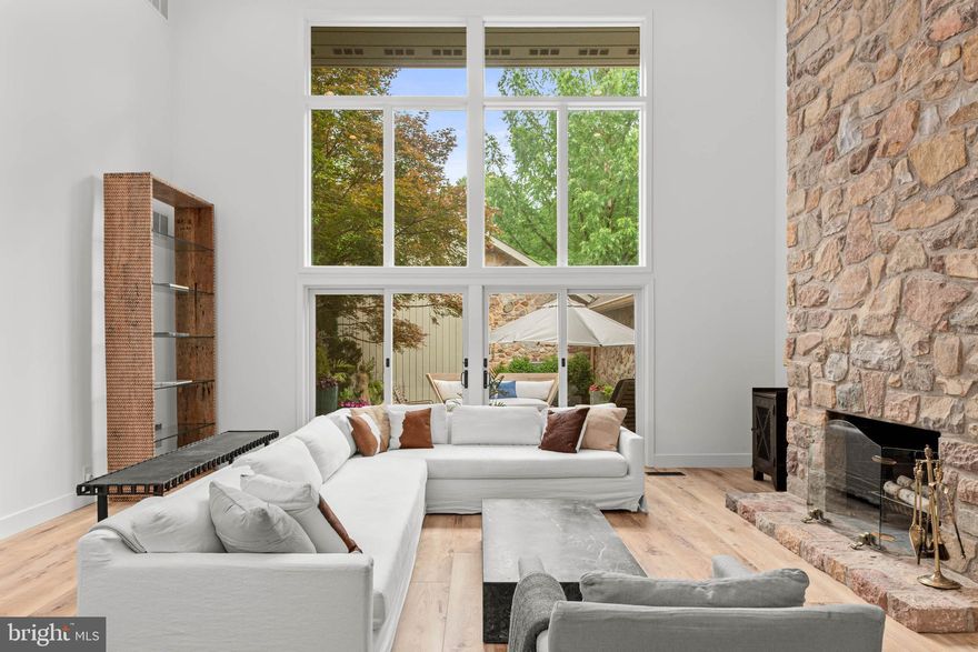 **PROFESSIONAL PHOTOS TO BE UPLOADED BY 6/20/25** A rare opportunity to own a beautifully reimagined home in The Hermitage, a serene and sought-after enclave in Bryn Mawr. This spacious interior unit blends classic Main Line architecture with luxurious modern upgrades, offering nearly 4,000 square feet of turnkey living across three thoughtfully curated levels.
Completely renovated in 2025, the home features five bedrooms, four full baths, and a powder room, with every detail selected for comfort, style, and function. Wide plank flooring extends through the main and garden levels, while plush new carpet brings warmth to the upstairs sleeping quarters. A reconfigured floorplan enhances both privacy and flow, unified by designer lighting & accents, solidcore interior doors, and fresh, contemporary paint finishes.
At the heart of the home, the kitchen has been fully modernized with custom cabinetry, sleek countertops, and new appliances. Ideal for both daily living and elegant entertaining, the main level features a fireside breakfast area, formal dining room, and a dramatic two-story living room anchored by a natural stone fireplace and expansive windows overlooking the private terrace and landscaped grounds.
The primary suite has been thoughtfully enhanced for comfort and seclusion, featuring full glass-walls enclosing a serene sitting area (to be completed), direct deck access, a fully outfitted walk-in closet, and a spa-inspired bathroom with radiant heated floors and all-new finishes. A private guest suite above the garage provides ideal accommodations, while a dedicated office with tranquil nature views offers a peaceful place to work or create.
The light-filled, walkout garden level delivers exceptional flexibility—offering a home gym, sauna, full bath, lounge, bedroom, and direct access to an outdoor patio—creating a wellness retreat right at home. Additional upgrades include a new bluestone walkway and patio, Trex deck, updated sliding glass doors, and a second laundry room. The detached two-car garage will feature a freshly epoxied floor plus electric vehicle charging, and includes a loft with a new minisplit and full bath—ideal for a studio, guest space, or office.
The Hermitage is more than just a place to live—it's a community designed to operate with peace of mind, and rooted in beauty, with winding walking paths, mature landscaping, and a quiet, park-like atmosphere. This is a rare opportunity to own a turnkey, design-forward home in one of the Main Line’s most peaceful and desirable neighborhoods.