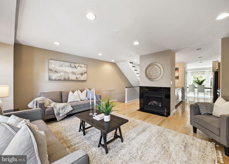 Sun-drenched and spacious, this stunning south-facing home in vibrant Bella Vista offers the perfect blend of style, comfort, and convenience—all within the sought-after Meredith Elementary catchment. With 3 generous bedrooms, a den, 2.5 baths, a large private garage, a deck, and a back yard this extra-wide 20-foot-wide home provides the space and flexibility everyone needs. As you step inside, a spacious hallway welcomes you- leading to a half bath and a coat closet, perfectly placed for everyday use. A versatile den on the first floor offers endless possibilities—set it up as a home office, playroom, or flex space to fit your lifestyle. From here, step out into a generous backyard, ready for outdoor play, entertaining, or cultivating your own garden oasis. The second floor is perfect for everyday living and entertaining, with an open-plan design that keeps everyone connected—featuring light-filled living and dining areas, a cozy gas fireplace, and a gourmet kitchen with an abundance of cabinets and a generous pantry, built for everyday meals and celebrations. The third floor has two large bedrooms with oversized closets, a full shared bath, and a conveniently located laundry room—making busy routines easier. You will love retreating to the 4th-floor suite, complete with a spa-like bath (jacuzzi + shower), a walk-in closet, and a private deck for morning coffee or evening relaxation, complete with views of the Center City skyline. Oh, and don’t forget the basement—it’s packed with storage and doubles as the perfect spot for your home gym. 
Outside your door, amenities abound: playgrounds, parks, award winning take out and restaurants, markets, and schools are all just a short walk away on one of the most desired blocks in Bella Vista. From Palumbo Playground and Cianfrani Park to Whole Foods, Acme, the Italian Market, John's Water Ice, Angelo's Pizzeria and more, everything you need is steps from home. Bright, functional, and move-in ready — this Bella Vista gem offers the perfect balance of city living and comfort.