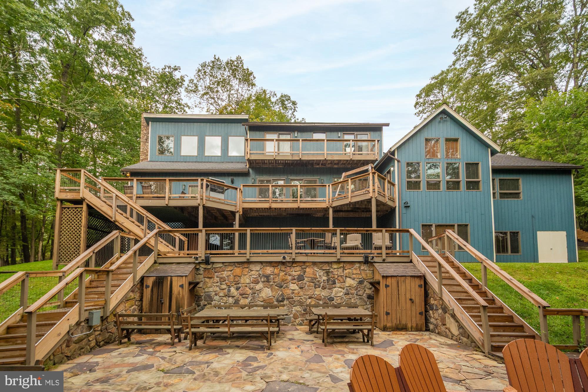 Excellent opportunity on Deep Creek Lake! Nestled on 1.74 private acres with 232 feet of prime lake frontage, 2345 Marsh Hill Road offers the perfect balance of space, privacy, and convenience. The expansive lakefront setting provides wide water views and direct access to your private dock slip, creating an ideal retreat for boating, swimming, and lakeside relaxation. The home’s open layout and large windows showcase the natural beauty that surrounds you, while multiple decks and outdoor spaces are designed for entertaining or simply unwinding in peace. Tucked away on a generous lot yet just minutes from Wisp Resort, this property combines seclusion with year-round recreation—skiing, golfing, hiking, and mountain adventure right at your doorstep. Whether as a full-time residence or a weekend escape, this exceptional lakefront parcel delivers the privacy, acreage, and shoreline that are rarely found on Deep Creek. Perfectly situated in a prime Deep Creek Lake location, this property is just minutes from restaurants, shopping, Wisp Resort, and state parks—making it an ideal retreat or year-round home that truly captures the essence of lakeside living. Call today to schedule your private showing!