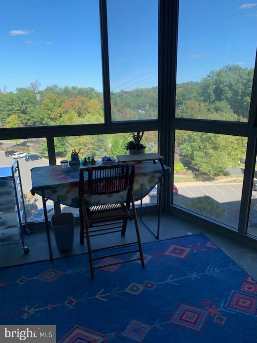 LARGE PRICE DISCOUNT!  THIS IS A LOVELY APARTMENT THAT YOU SHOULDN'T MISS!  ENJOY THE NEXT PHASE OF YOUR LIFE IN THIS BRIGHT, GRACIOUS APARTMENT OVERLOOKING TREES AND GREENERY.  TWO GENEROUS BEDROOMS WITH ENSUITE BATHS; SPACIOUS LIVING ROOM WITH SLIDING GLASS DOORS TO THE PERFECT ENCLOSED BALCONY (GLASS AND SCREEN); DINING ROOM WITH BREAKFAST BAR OR PASS THRU (OR BOTH, YOUR CHOICE!) FROM THE TABLE SPACE KITCHEN.  DON'T FORGET TO NOTICE THE LOVELY AND WORRY-FREE LVP FLOORS THROUGHOUT.  BUILDING HAS A COMMUNITY ROOM FOR PARTIES AND GATHERINGS (OR JUST RELAXING AND READING A BOOK FROM ITS HONOR-SYSTEM LIBRARY); GRACIOUS BUILDING ENTRY AND LOBBY; AND THREE ELEVATORS (NO WAITING!).