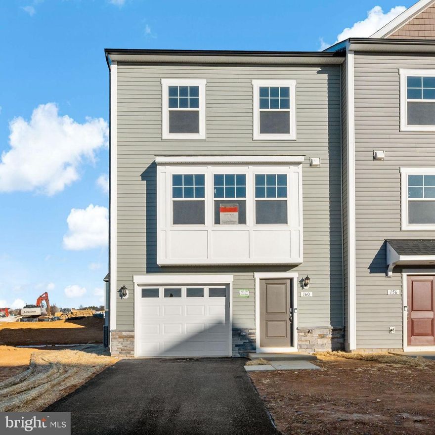 Welcome to King's Crossing! The newest neighborhood in Charles Town, WV. This spacious end of row townhome offers 3 bedrooms, 3.5 bathrooms and features an open floor plan as well as an LED lighting package. The well-appointed kitchen features an extended  island, upgraded cabinets with Quartz countertops, stainless steel appliances, and much more. This home has a great space for an office, or rec/gaming room in the lower level. The primary suite features a tray ceiling, a walk-in closet and ensuite with dual sink vanity. Two secondary bedrooms, a full bathroom, and a conveniently located laundry area complete the upper floor. *Photos may not be of actual home. Photos may be of similar home/floorplan if home is under construction or if this is a base price listing. AGENT REGISTRATION REQUIRED.