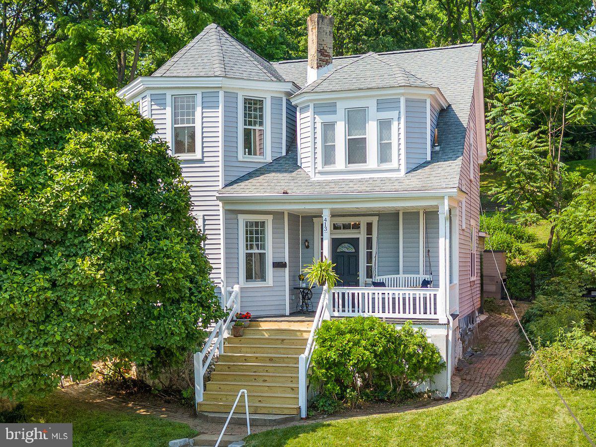 Have you ever wondered what it’s like to step back in time 100+ years and still have the modern conveniences of today? With sweeping views of Brunswick, this stately Victorian marries the charm of the late 1800’s and present day features. Owners have taken care to update the oil tank, double ovens, porch steps, basement door, fresh paint, deck and thoughtfully added durable luxury vinyl plank throughout matching the aesthetic. Over 2500 sq feet of living space and 10 foot ceilings, they just don’t make them like this anymore!
Stroll up to the entrance and enjoy the idyllic views from the porch swing. Entering the foyer, the historic details of arched doorways and corner block add charm throughout. Large formal living room with bay windows is light and bright and a generously sized dining room brings the wow factor when entertaining. Family room provides extra living space and cozies up with a propane fireplace. The kitchen is a dream, expanding the back side of the house with a walk-in pantry, half bath, cooktop, double ovens, open shelving, and island. Your sourdough will love it here! Sip your coffee on the deck, through the sliding glass doors, enjoying the hydrangeas.
Upstairs the primary bedroom bay windows bring light, with privacy from the front yard tree. Wainscotting adds an elevated feel to the large haven. A built-in bookshelf, spanning the width and length of the hallway, is one out of fairytales. The three other bedrooms impress with notable details and space. A versatile bonus room has so much potential as an office, playroom, home gym or craft area. Laundry is also located on this level for ease of living. Two full bathrooms round out this space!
One of the larger lots in Brunswick, the backyard also brings potential for gardens or a grassy knoll and provides a pleasing view from the kitchen and back bedroom. Playhouse conveys - a space for imaginative play!
Brunswick is a small town feel with a big heart! Very commuter friendly to Baltimore and DC with a MARC train stop too. Great walkability to Brunswick and the C&o canal/Potomac river for those that love the outdoors and small town life! Walk to Boxcar Burgers, Beans in the Belfry, three new bakeries and you never have to find parking for the Veterans Day parade, or any of the downtown festivals. Ride your bike to Harper’s Ferry directly from the house! Timeless architecture, spacious interior and everyday comforts come together in this beautifully preserved home; offering a rare opportunity to own a piece of history!