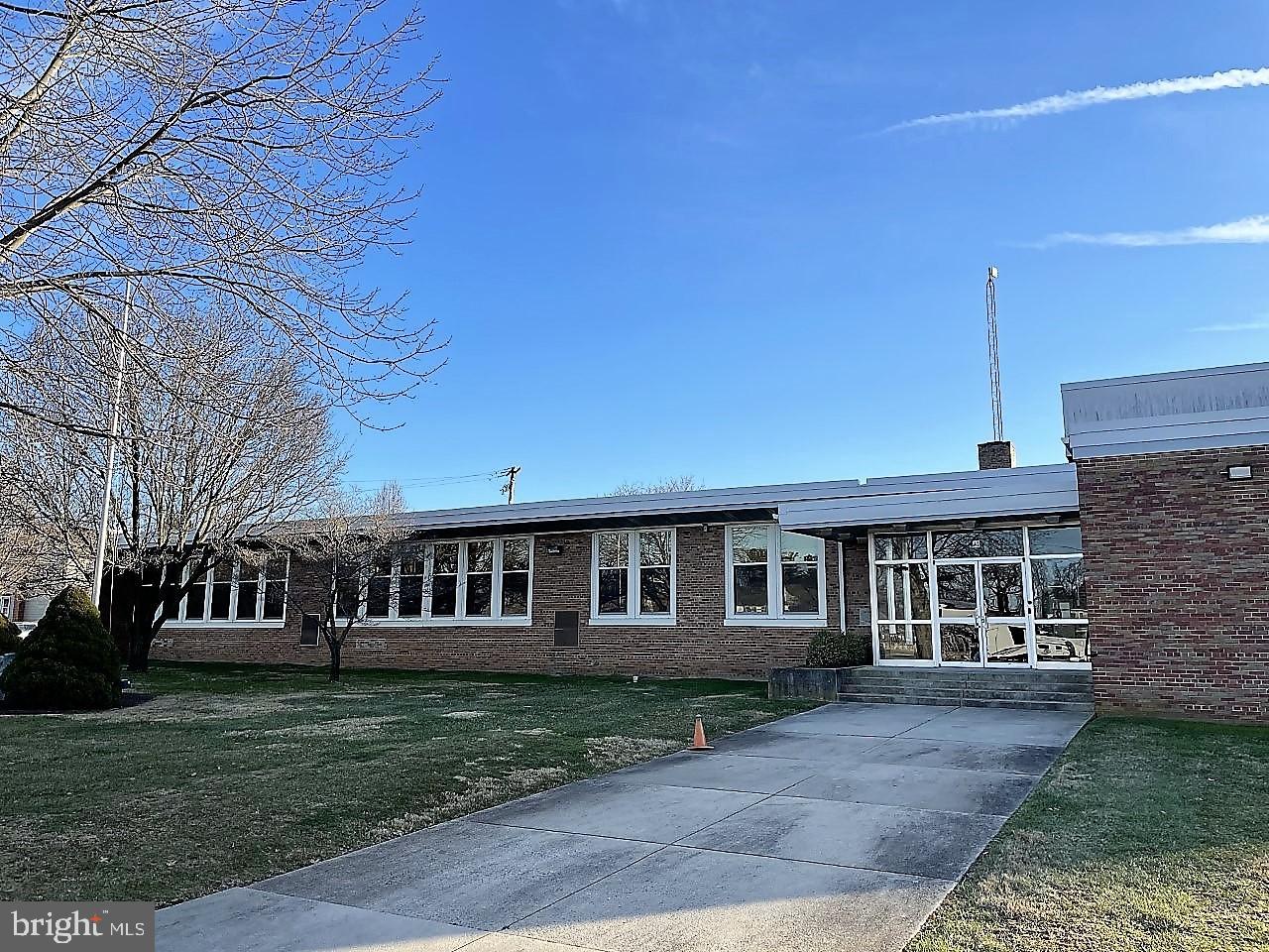 Former Strasburg Elementary School consists of 2.833 acres or 123,396 square feet of land improved with a 28,836 square foot former elementary school. The first floor of the property is 19,352 +/- SF, with a 7,860 +/- SF finished lower level and a 1,624 +/- SF unfinished basement. The unfinished basement area consists of two rooms: a storage area and mechanical room with an outside entrance. The finished lower basement level contains four classrooms, two storage rooms, and two restrooms. The first floor
contains a main office, nurse's room with lavatory, commercial kitchen, cafeteria, nine classrooms, library with restroom, music room, faculty lounge with restroom, and two primary restrooms. There are 73+ o street vehicle parking spaces and a play ground.