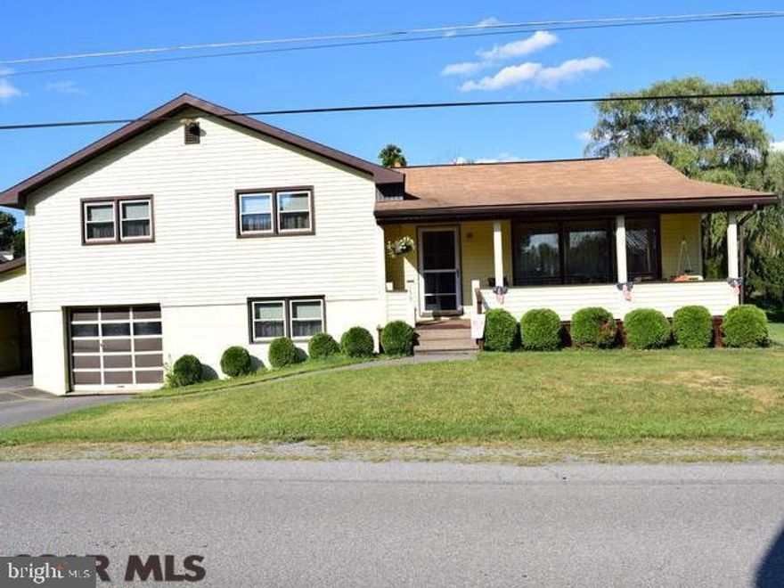 Looking for a spacious home situated on a large flat corner lot with easy access to Bald Eagle Area High School, I-80 and to PSU? This three level house plus large basement boasts new vinyl siding, a great front porch with views, 1-car garage plus attached carport. The main level has a large open dining and living area for all occasions plus kitchen. The upper level has 4 bedrooms, and full bath. The lower level has a recreational or family room, laundry room, 1/2 bath, and walk-out to garage. The basement has a large workshop and mechanical area with lots of room for storage. Very clean and well-trimmed property being sold as is. Includes a 12 month HSA home warranty. Your touch will bring equity to this valuable property.