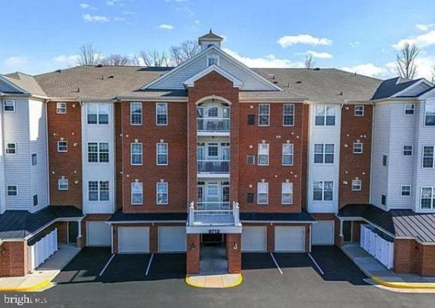 Coming Soon! Situated in the Reserve Condominiums at Manassas Park, this corner two-bedroom, two-bath residence offers approximately 1,480 square feet of well-planned living space with the convenience of main-level access. The layout features an open design with 9-foot ceilings, crown molding, and large windows that bring in abundant natural light throughout the home. The living area opens to a flexible den space that can accommodate a home office, sitting area, or dining setup. The primary bedroom includes two walk-in closets and a private bath with dual vanities, a soaking tub, and a separate walk-in shower with built-in seating. A second bedroom with generous closet space is located near the full hall bath, providing a comfortable option for guests or additional household members. Outdoor enjoyment is offered through a private balcony, suitable for everyday use. Additional features include in-unit laundry, one assigned parking space, and a guest parking pass. Community amenities include sidewalk access, a nearby swimming pool, and close proximity to the Manassas Park VRE station, offering a convenient option for commuting. This is the one!