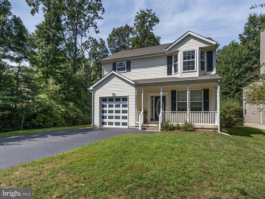 Impressive 3 bedroom 2.5 bath home with cathedral ceilings. Hardwood floors throughout first floor. Huge deck off kitchen with fenced in level yard backing to woods.  Master bath has whirlpool tub to relax in after a hard days work. Water filtration system. Community Amenities include Beaches, Piers, Harbor, Ramps, Fields, Park. All in time to watch the beautiful fall sunsets on the Chesapeake