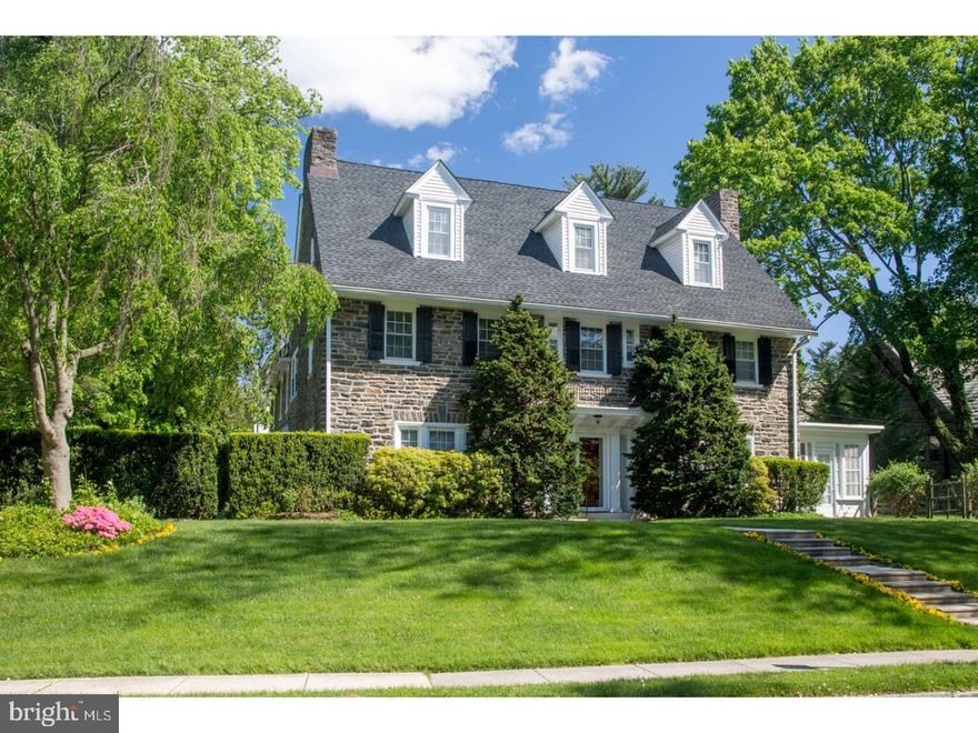 127 St. Georges Road is an extraordinary all stone center hall colonial home in beautiful condition located in the coveted neighborhood of North Ardmore. With over 6000 square feet of living space on 3 levels, this classic 1900's home features unique spaces for a home built in this era, including a family room and breakfast room off the renovated eat-in kitchen. The wide center hall is flanked by the roomy fireside living room and the formal dining room, featuring a lovely staircase. The sunny side porch is off the living room, accessed by two sets of french doors flanking the LR fireplace, and the cozy study includes built-in bookcases, a wood burning fireplace, french doors to the rear patio and is adjacent to the powder room. The master suite is spacious, with lovely french doors leading outside with his & her closets and vanities, a shower and soaking tub. There are three additional second floor bedrooms, all generous sized with high ceilings, 2 with fireplaces, one with custom built-ins. The laundry is on the second floor and located off the circular stairway that leads downstairs to the family room. The third floor includes 2 large bedrooms, a hallway bathroom and a large sky-lit studio/exercise room. The basement is partially finished with a full bath and a large carpeted storage room. Outside in addition to a charming patio off the study, there is a detached two car garage just steps to the family room vestibule entrance. Convenience is the hallmark of this North Ardmore community, where walking to the Ardmore train station, Suburban Square and downtown Ardmore and it's shops and restaurants is the norm. Sitting prominently on the high side of St. Georges road, 127 St. Georges Road is a quintessential classic Main Line home.