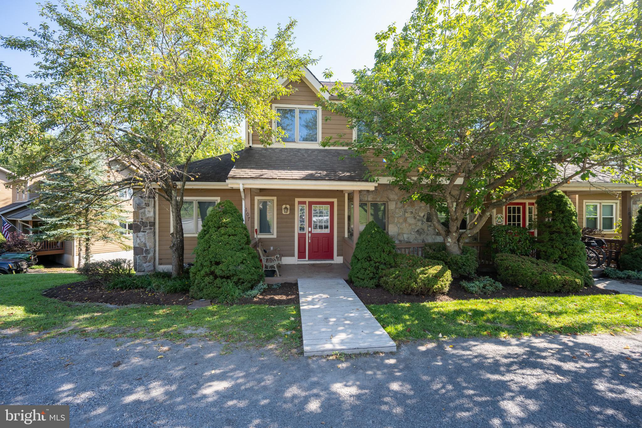 Fantastic Investment or Vacation Getaway!
Just steps from the lake and ski slopes, and only minutes to shopping, dining, and all that Deep Creek has to offer! This spacious 5-bedroom, 5-bath townhome features three primary suites, making it ideal for family gatherings or rental guests.
The main living area boasts a cozy gas fireplace framed in beautiful native stone and opens to a large deck overlooking the woods—perfect for morning coffee or evening relaxation. The lower-level game room walks out to a patio with a brand-new hot tub and a fire pit for year-round fun.
Enjoy the charm of a covered front porch, plenty of room to spread out, and a property that comes fully furnished. Already an established vacation rental, this is your chance to own a home that’s as comfortable as it is profitable—just minutes from Wisp Resort and all Lake activities!