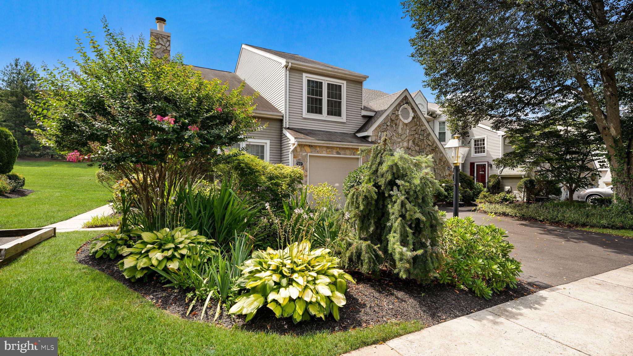 Welcome to this lovely 3-bedroom, 2.5-bath end-unit townhome located in the sought-after Greens of Doylestown. A charming side entrance leads into the foyer with ceramic tile flooring. To the right, you'll find a sunken family room featuring a cozy gas fireplace and carpeted —perfect for relaxing evenings. To the left, the updated eat-in kitchen boasts granite countertops and modern stainless-steel appliances. The living and dining rooms feature beautiful luxury laminate hardwood flooring, creating a warm and inviting space for everyday living and entertaining. A recently remodeled powder room and a one-car garage with inside access complete the main level. Upstairs, the spacious primary suite includes a full bath with double vanity, walk-in shower, and a relaxing soaking tub. Two additional nicely sized bedrooms, a full hall bath, and second-floor laundry offer comfort and convenience. The unfinished basement provides plenty of space for storage or future finishing potential. Step outside to enjoy the beautifully maintained landscaping with mature plantings and a private deck—easily accessed from the living room—for enjoying peaceful evenings outdoors. Additional highlights include NEW HVAC, replacement windows throughout and a prime end-unit location offering added privacy and natural light. This well-maintained home is ready for you to move right in!