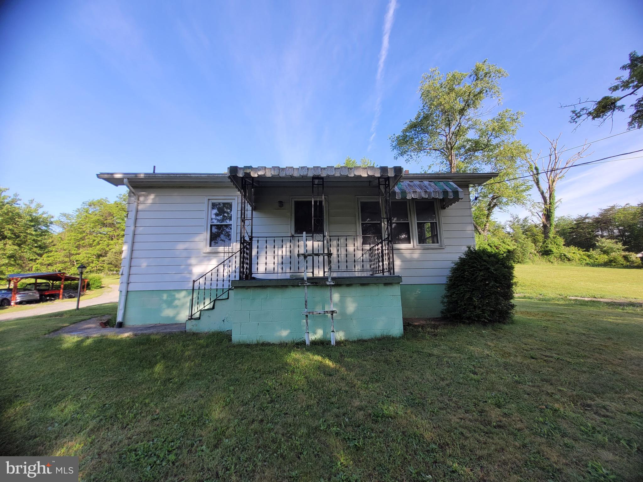 Welcome to your new home!! This well maintained 2 bedroom one bathroom cottage makes for a great starter home or someone looking to downsize! Pull into the driveway or into one of the two garage spaces and walk into the side entrance of the house without any steps! Walk in the side door where there will be a few steps to get into the kitchen. The kitchen has been customized with homemade cabinets and built to last!! Refrigerator and stove both function and will convey with the sale!! Living areas have been carpeted, but may have hardwood floors underneath. Sellers had a new well dug within the last several months. Well was dug 300 feet deep!! No water bill here! The extra lot could provide space for another building and the well could supply it, also. Sewage has also remained on, so no hookup fees would need to be spent to get it turned back on. New wash sink was also installed in the basement. Furnace is fairly new and installed in 2012. Propane has also been replenished, so you're ready for the winter already!! Schedule your appointment
House is strictly being sold as-is. Sellers will make no repairs based on inspection results. All appliances in the house do convey, but not certain of freezer viability in the basement.