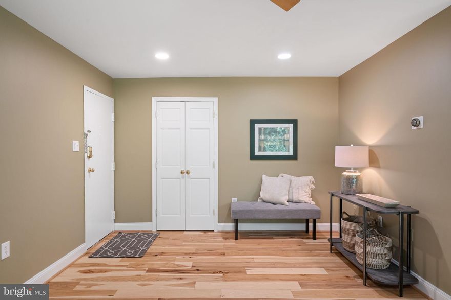 Welcome home to this rare, top level 3-bedroom condo in Ivymount Court!  Gorgeous and ready for you to move in and start your new life close to everything! The large living room and entryway feature new hardwood floors and a wall of windows, with private views flooding the room with an abundance of natural light. Step out onto the roomy balcony and enjoy the serene view! The open floor plan makes the space perfect for entertaining. In the kitchen, you’ll find solid cabinets, granite countertops and a tile backsplash. The primary has an en suite and private, tree top views to wake up to every morning. All utilities except electric are included in the condo fee and amenities include a community pool and abundant parking. You can’t beat this accessible location - close to everything yet tucked away in a private oasis.  Take a short walk to restaurants, shopping and entertainment. Minutes to I-495 and a metro bus stop just out your front door. Come check out your new home today!